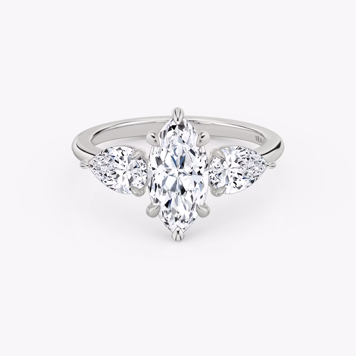 The Three Stone | Marquise | Platinum | bandAccent: Plain | sideStoneCarat: 0.50ct | sideStoneShape: Pear | diamondOrientation: vertical | caratWeight: other