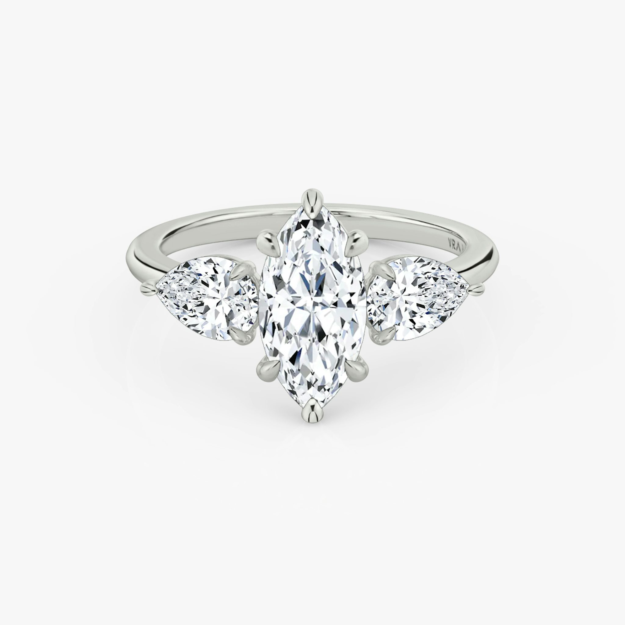 The Three Stone | Marquise | 18k | White Gold | bandAccent: Plain | sideStoneCarat: 0.50ct | sideStoneShape: Pear | diamondOrientation: vertical | caratWeight: other