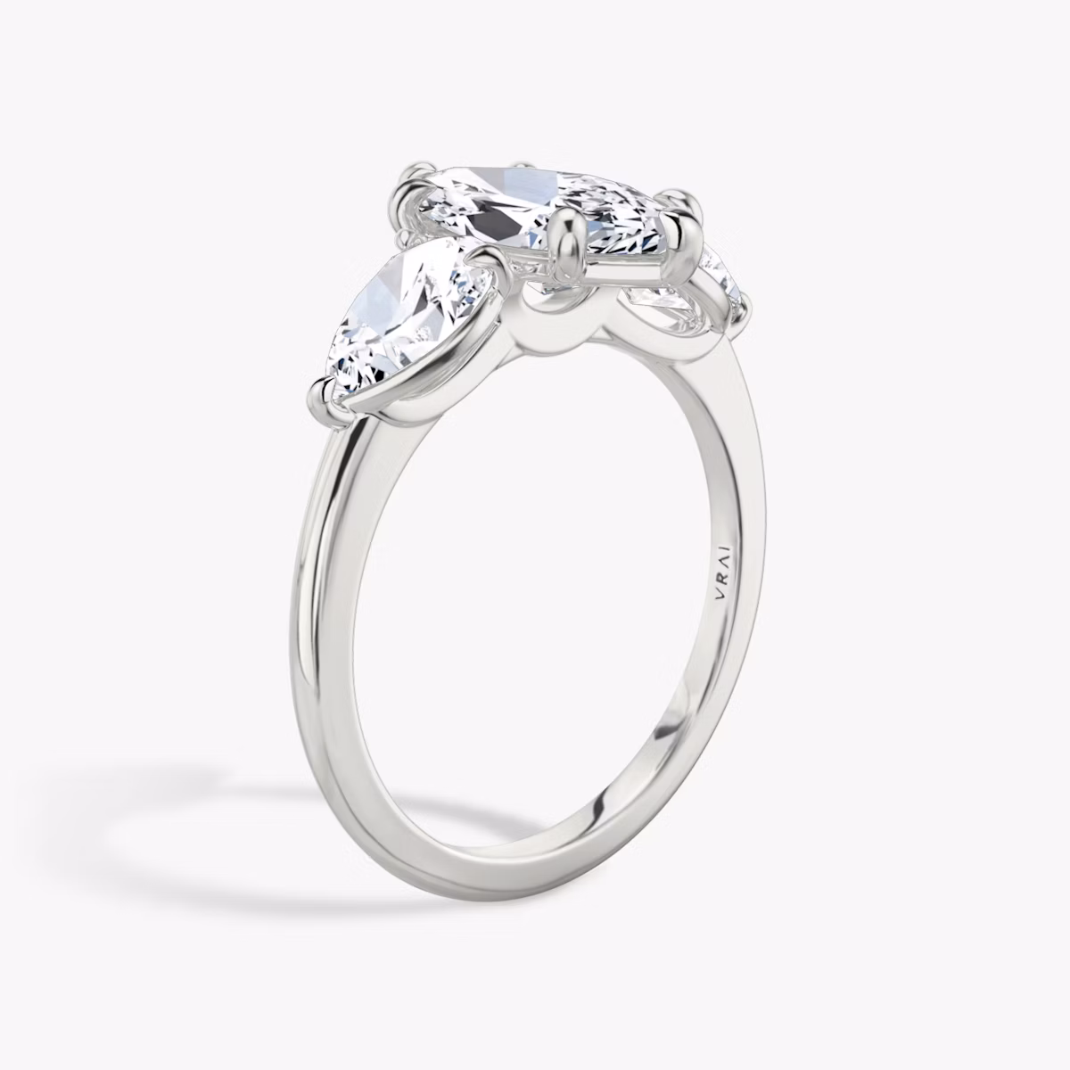 The Three Stone | Marquise | Platinum | bandAccent: Plain | sideStoneCarat: 0.50ct | sideStoneShape: Pear | diamondOrientation: vertical | caratWeight: other