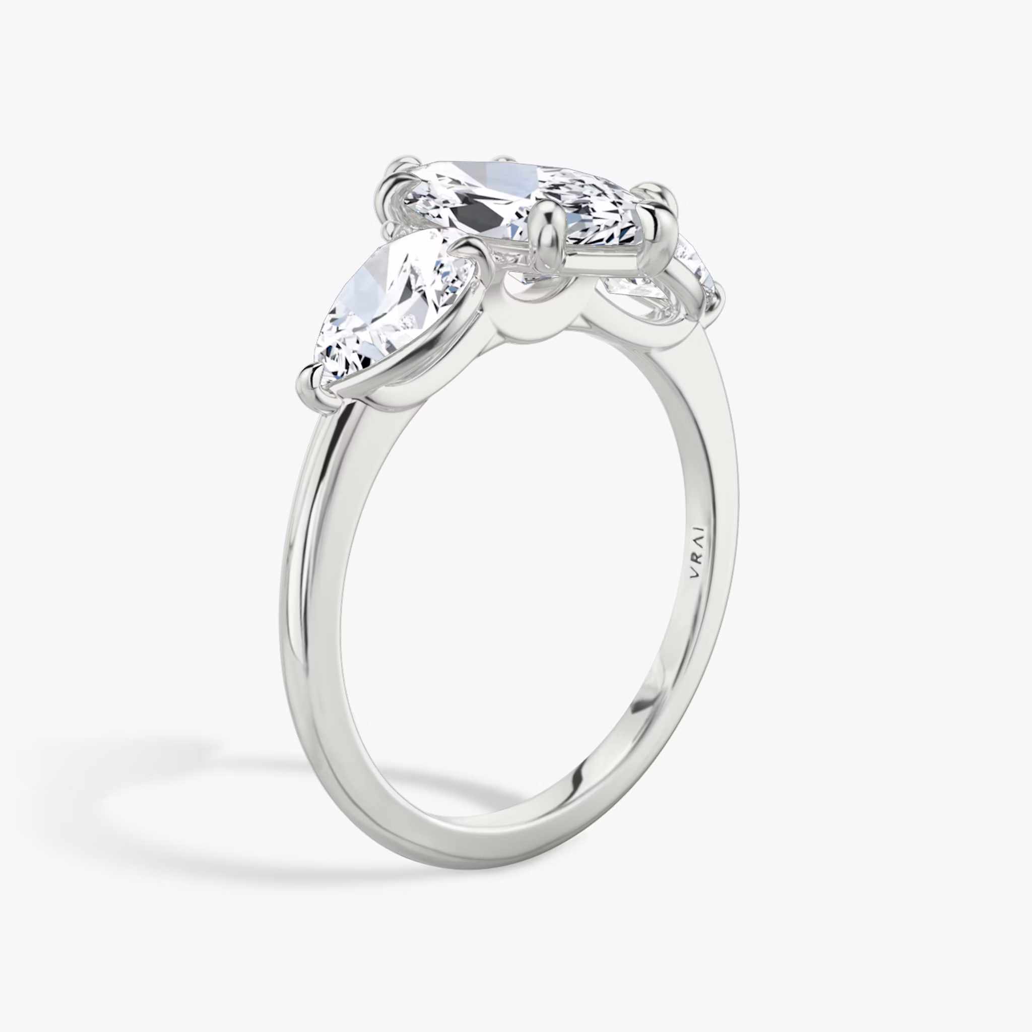 The Three Stone | Marquise | 18k | White Gold | bandAccent: Plain | sideStoneCarat: 0.50ct | sideStoneShape: Pear | diamondOrientation: vertical | caratWeight: other