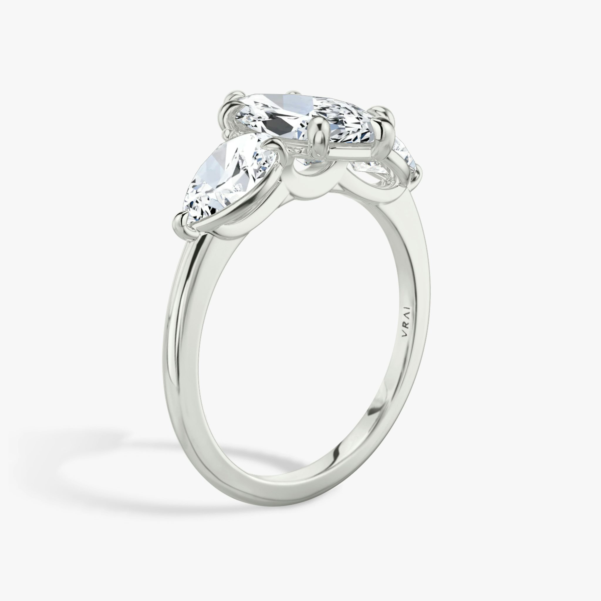 The Three Stone | Marquise | 18k | White Gold | bandAccent: Plain | sideStoneCarat: 0.50ct | sideStoneShape: Pear | diamondOrientation: vertical | caratWeight: other