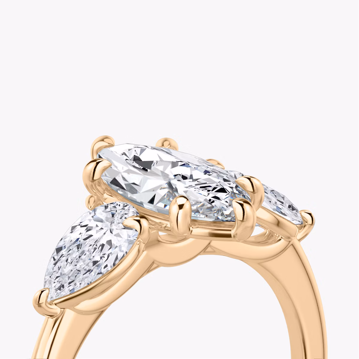 The Three Stone | Marquise | 14k | Rose Gold | bandAccent: Plain | sideStoneCarat: 0.50ct | sideStoneShape: Pear | diamondOrientation: vertical | caratWeight: other