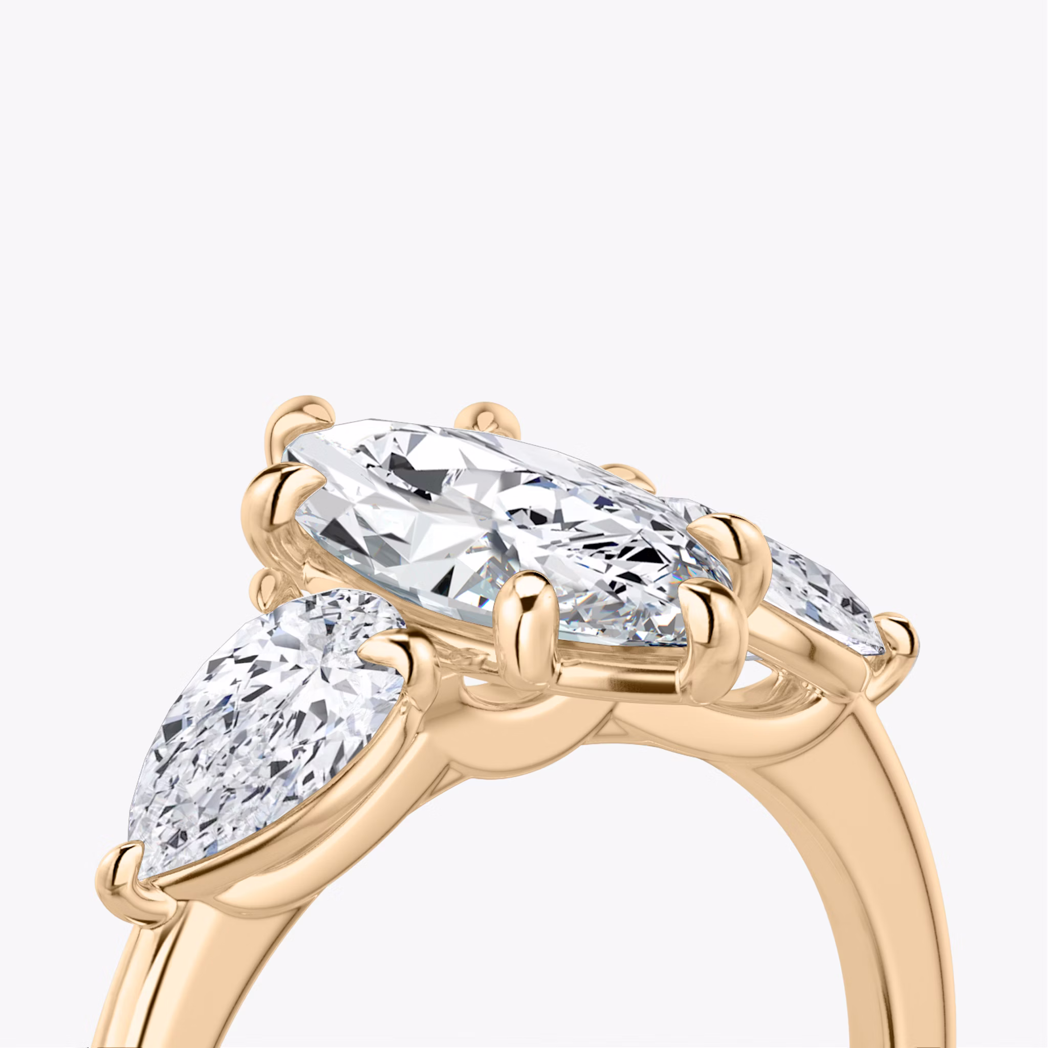 The Three Stone | Marquise | 14k | Rose Gold | bandAccent: Plain | sideStoneCarat: 0.50ct | sideStoneShape: Pear | diamondOrientation: vertical | caratWeight: other