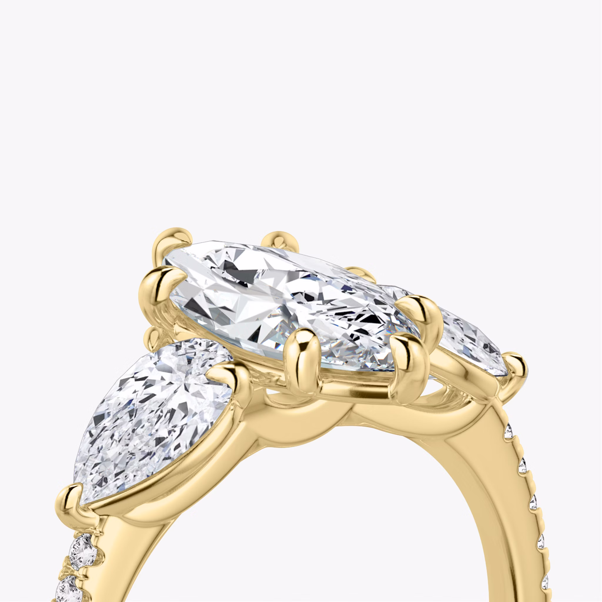 The Three Stone | Marquise | 18k | Yellow Gold | bandAccent: Pavé | sideStoneCarat: 0.50ct | sideStoneShape: Pear | diamondOrientation: vertical | caratWeight: other