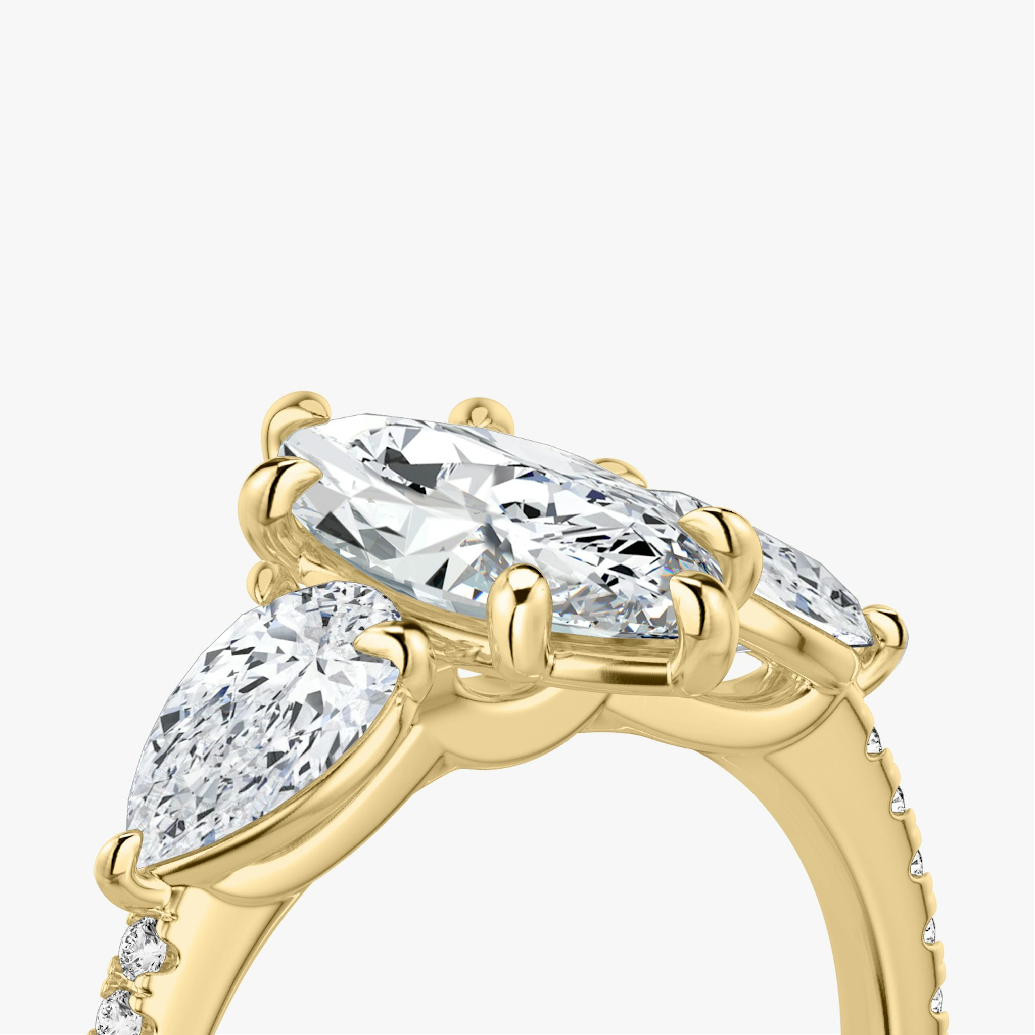 The Three Stone | Marquise | 18k | Yellow Gold | bandAccent: Pavé | sideStoneCarat: 0.50ct | sideStoneShape: Pear | diamondOrientation: vertical | caratWeight: other