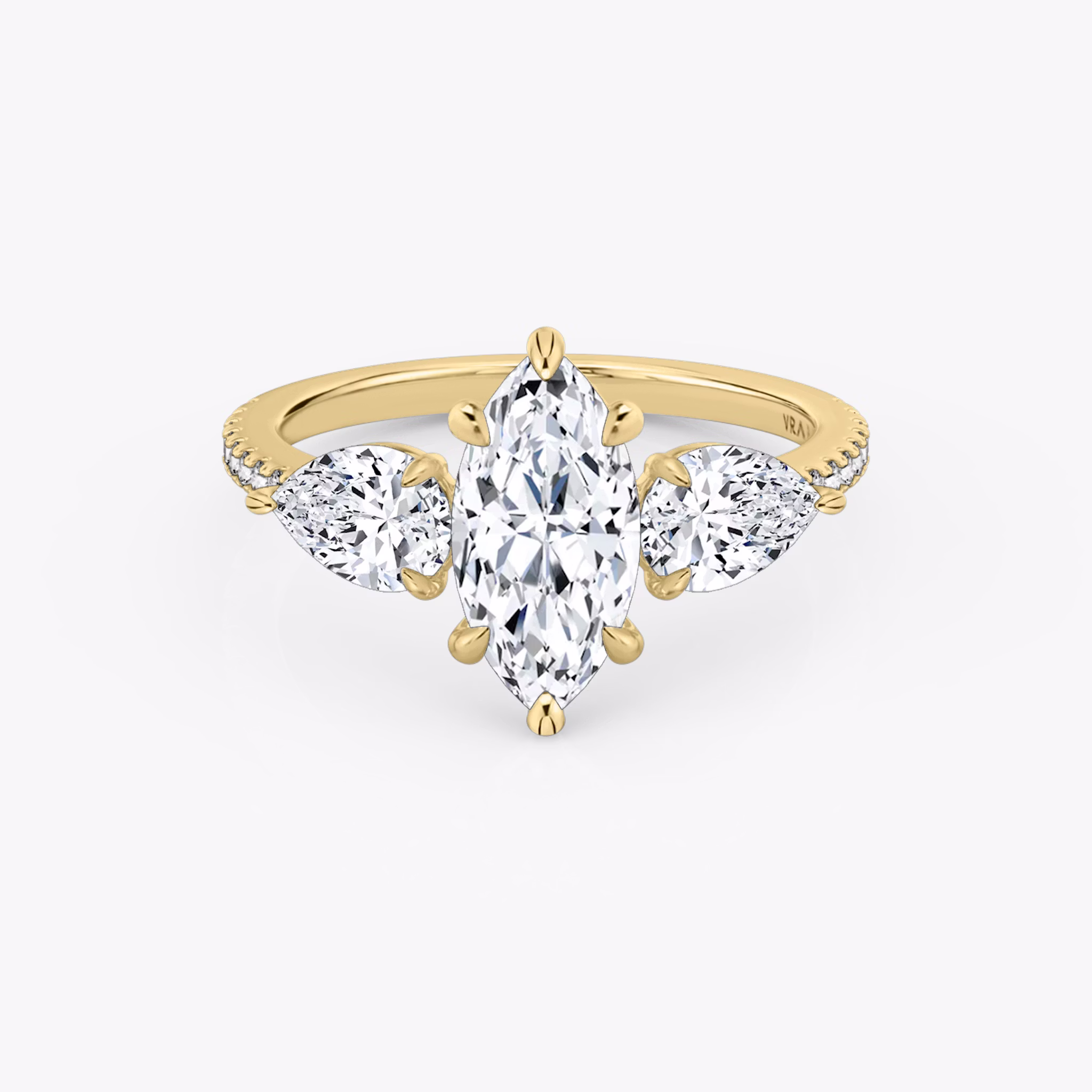 The Three Stone | Marquise | 18k | Yellow Gold | bandAccent: Pavé | sideStoneCarat: 0.50ct | sideStoneShape: Pear | diamondOrientation: vertical | caratWeight: other