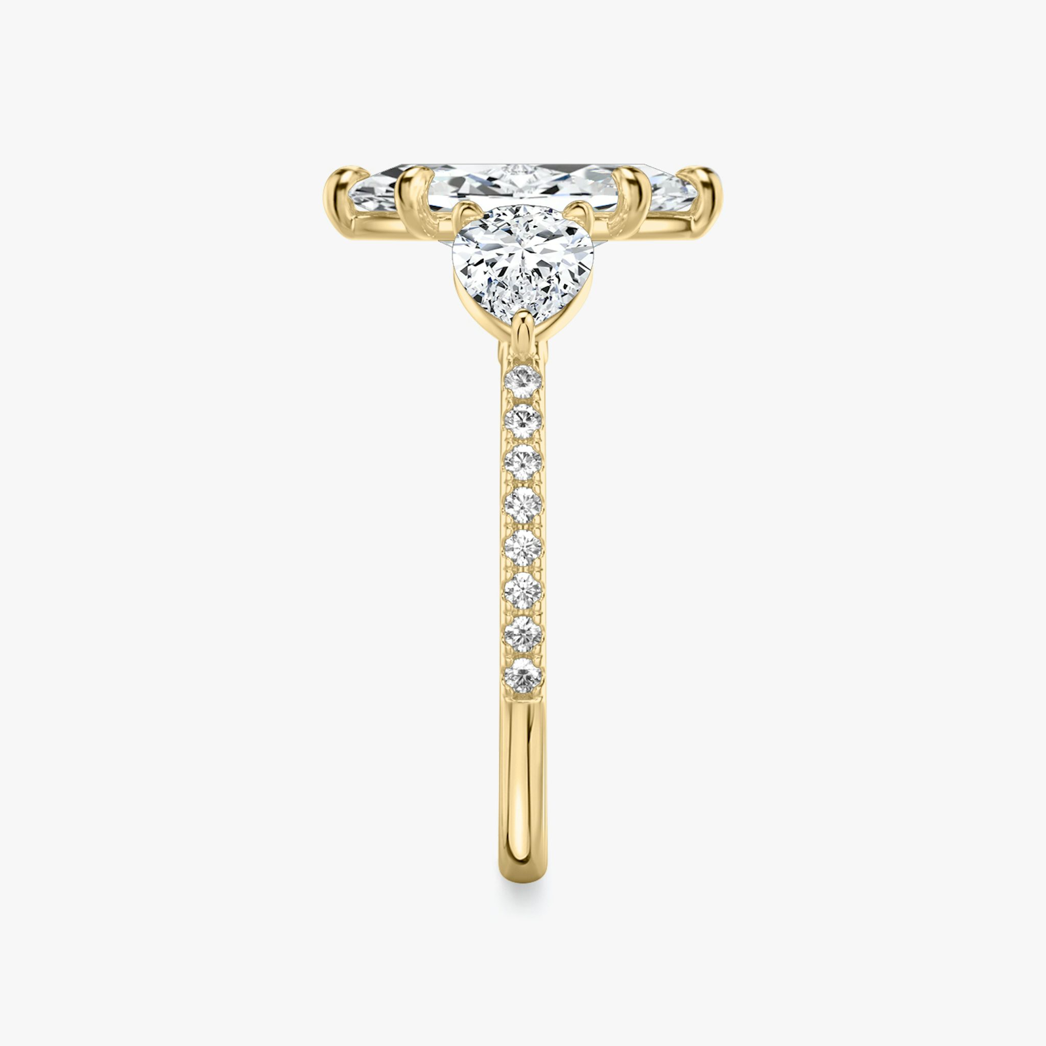 The Three Stone | Marquise | 18k | Yellow Gold | bandAccent: Pavé | sideStoneCarat: 0.50ct | sideStoneShape: Pear | diamondOrientation: vertical | caratWeight: other