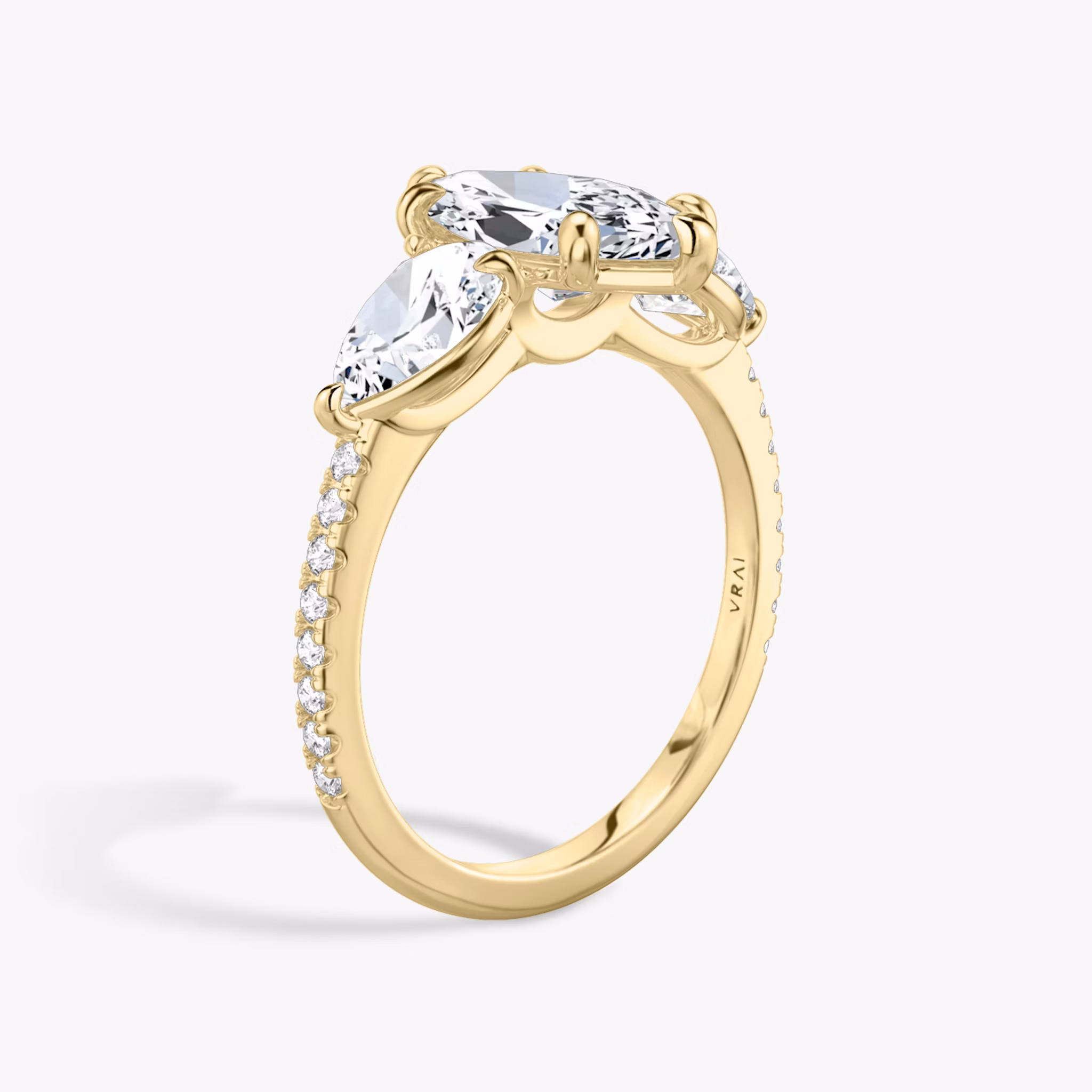 The Three Stone | Marquise | 18k | Yellow Gold | bandAccent: Pavé | sideStoneCarat: 0.50ct | sideStoneShape: Pear | diamondOrientation: vertical | caratWeight: other