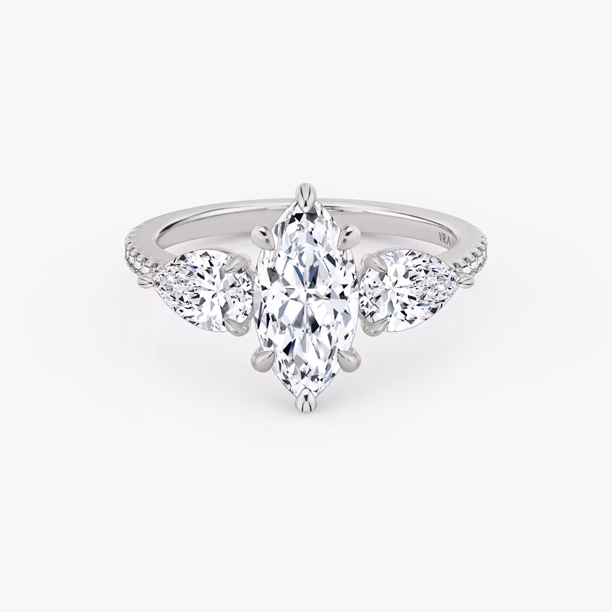 The Three Stone | Marquise | Platinum | bandAccent: Pavé | sideStoneCarat: 0.50ct | sideStoneShape: Pear | diamondOrientation: vertical | caratWeight: other
