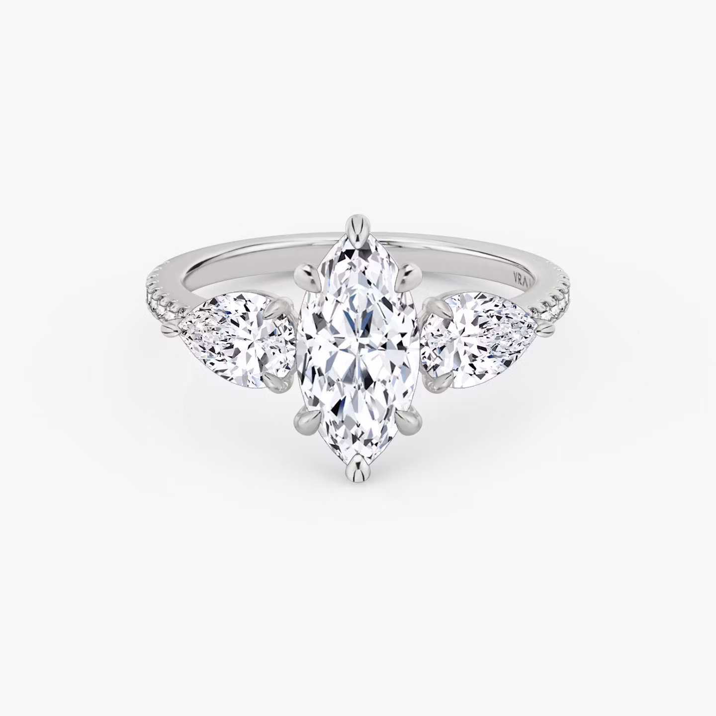 The Three Stone | Marquise | Platinum | bandAccent: Pavé | sideStoneCarat: 0.50ct | sideStoneShape: Pear | diamondOrientation: vertical | caratWeight: other