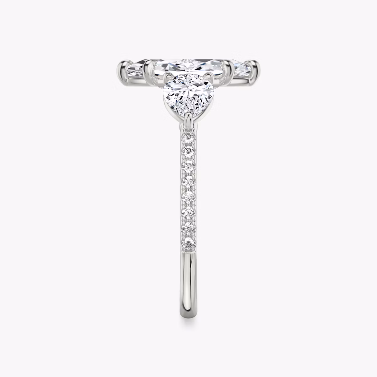 The Three Stone | Marquise | Platinum | bandAccent: Pavé | sideStoneCarat: 0.50ct | sideStoneShape: Pear | diamondOrientation: vertical | caratWeight: other