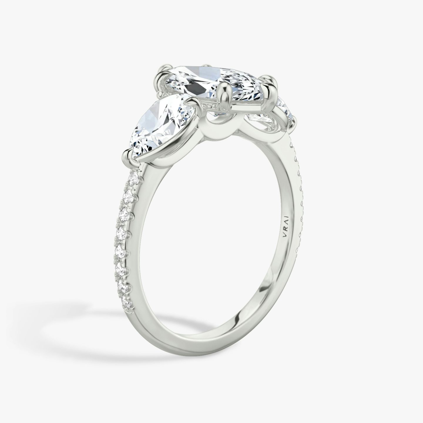 The Three Stone | Marquise | Platinum | bandAccent: Pavé | sideStoneCarat: 0.50ct | sideStoneShape: Pear | diamondOrientation: vertical | caratWeight: other