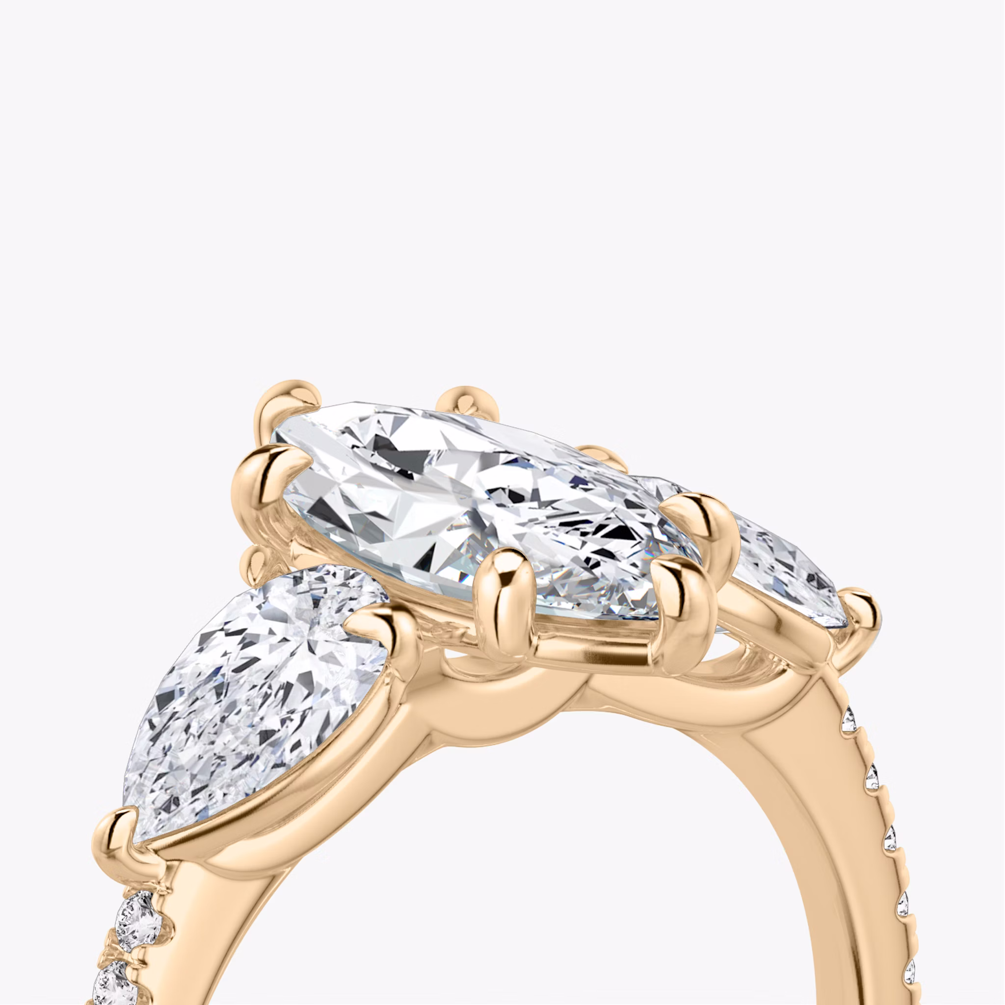 The Three Stone | Marquise | 14k | Rose Gold | bandAccent: Pavé | sideStoneCarat: 0.50ct | sideStoneShape: Pear | diamondOrientation: vertical | caratWeight: other