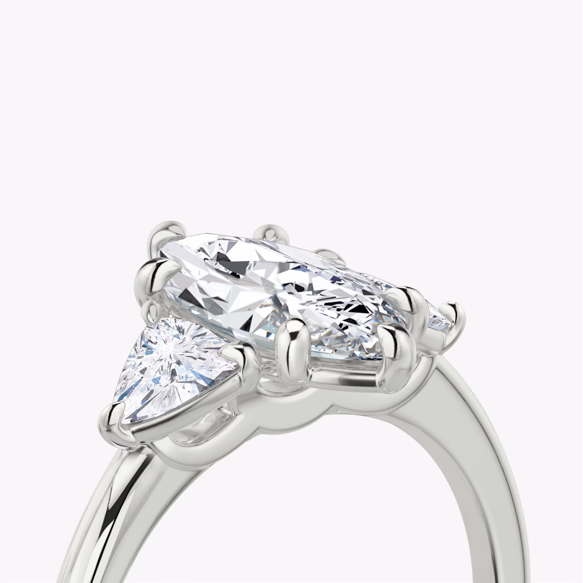 The Three Stone | Marquise | 18k | White Gold | bandAccent: Plain | sideStoneCarat: 0.25ct | sideStoneShape: Trillion | diamondOrientation: vertical | caratWeight: other