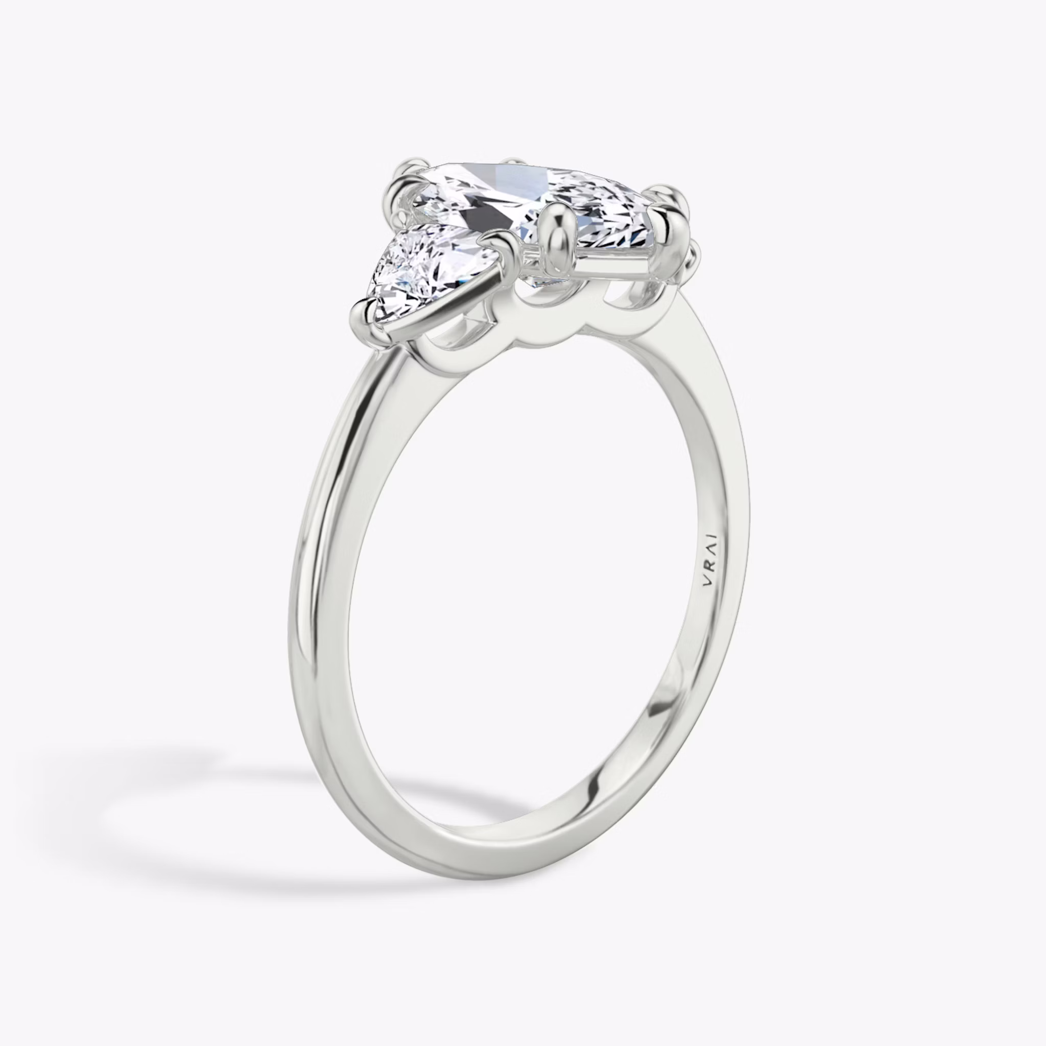 The Three Stone | Marquise | 18k | White Gold | bandAccent: Plain | sideStoneCarat: 0.25ct | sideStoneShape: Trillion | diamondOrientation: vertical | caratWeight: other