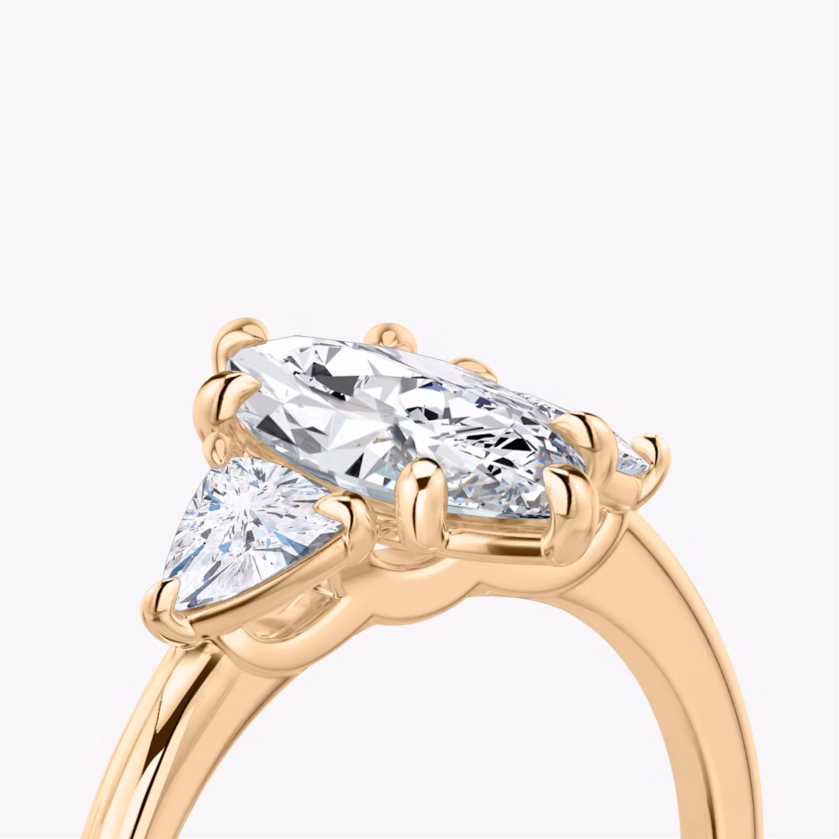 The Three Stone | Marquise | 14k | Rose Gold | bandAccent: Plain | sideStoneCarat: 0.25ct | sideStoneShape: Trillion | diamondOrientation: vertical | caratWeight: other