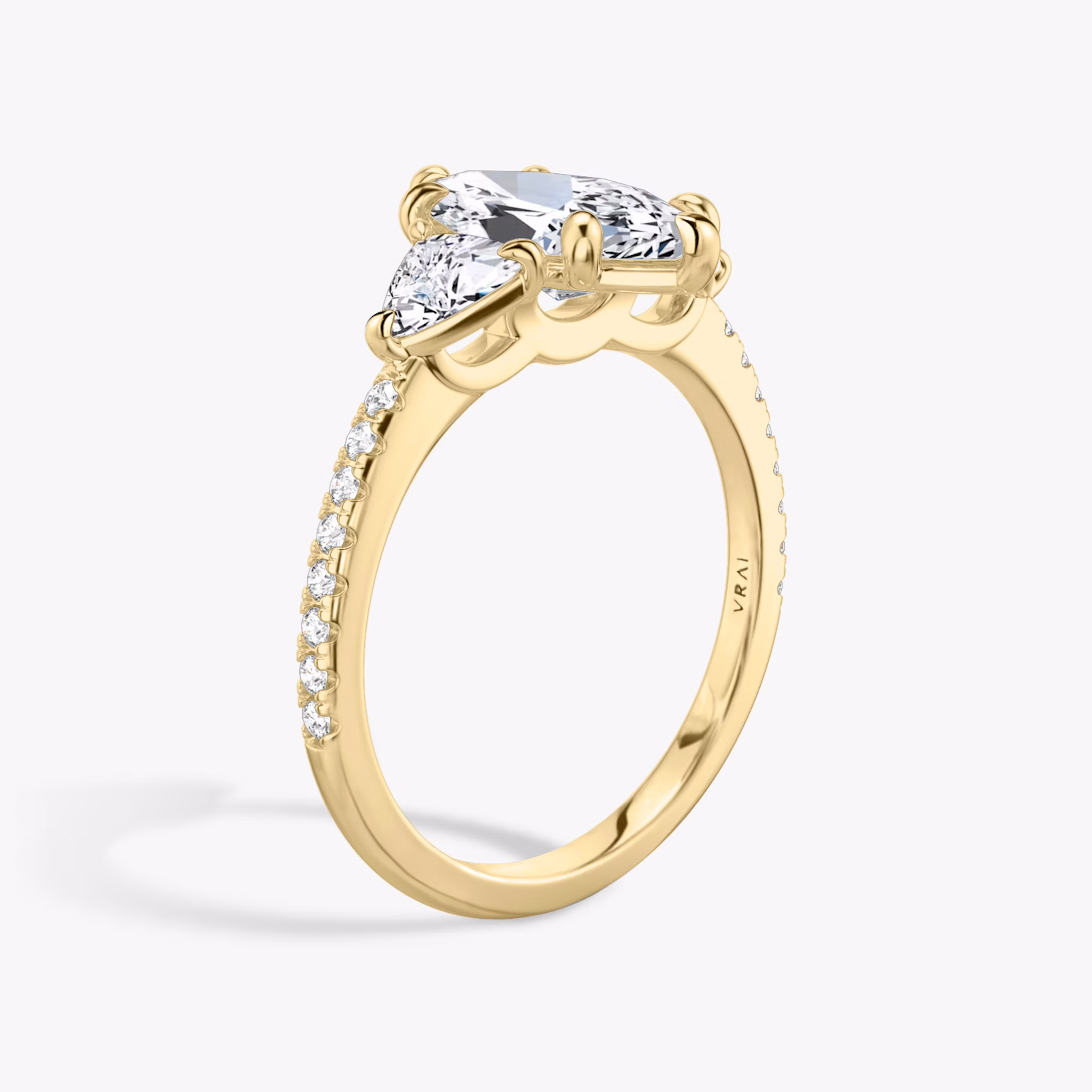 The Three Stone | Marquise | 18k | Yellow Gold | bandAccent: Pavé | sideStoneCarat: 0.25ct | sideStoneShape: Trillion | diamondOrientation: vertical | caratWeight: other