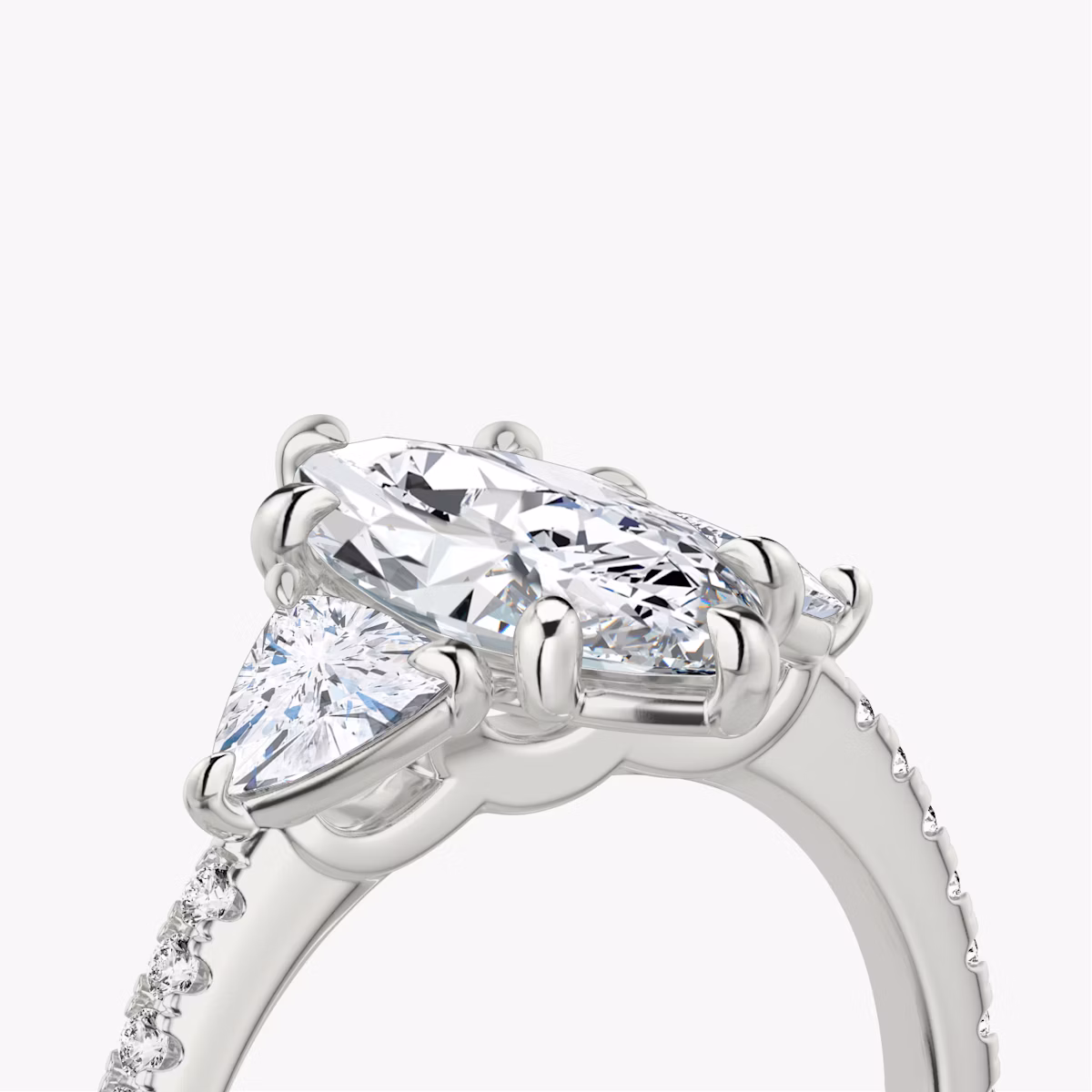 The Three Stone | Marquise | Platinum | bandAccent: Pavé | sideStoneCarat: 0.25ct | sideStoneShape: Trillion | diamondOrientation: vertical | caratWeight: other