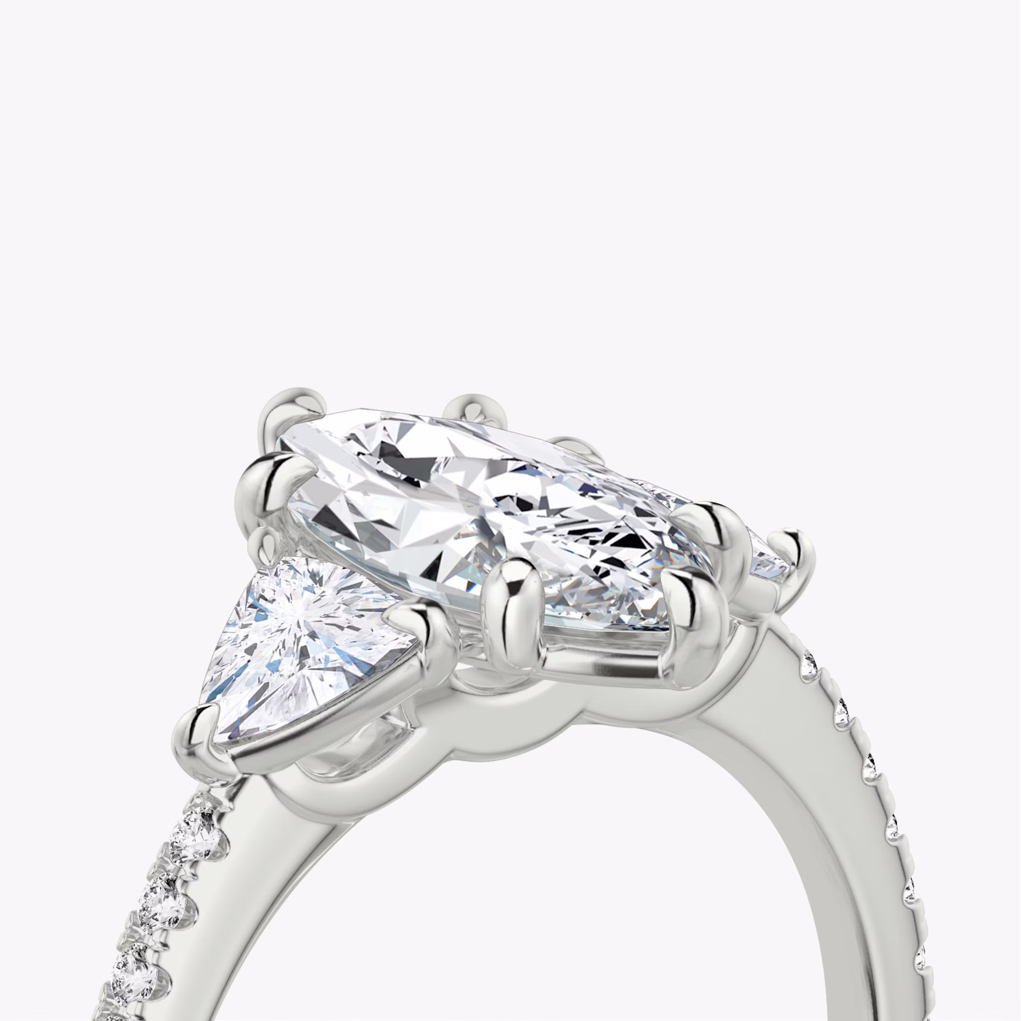 The Three Stone | Marquise | 18k | White Gold | bandAccent: Pavé | sideStoneCarat: 0.25ct | sideStoneShape: Trillion | diamondOrientation: vertical | caratWeight: other