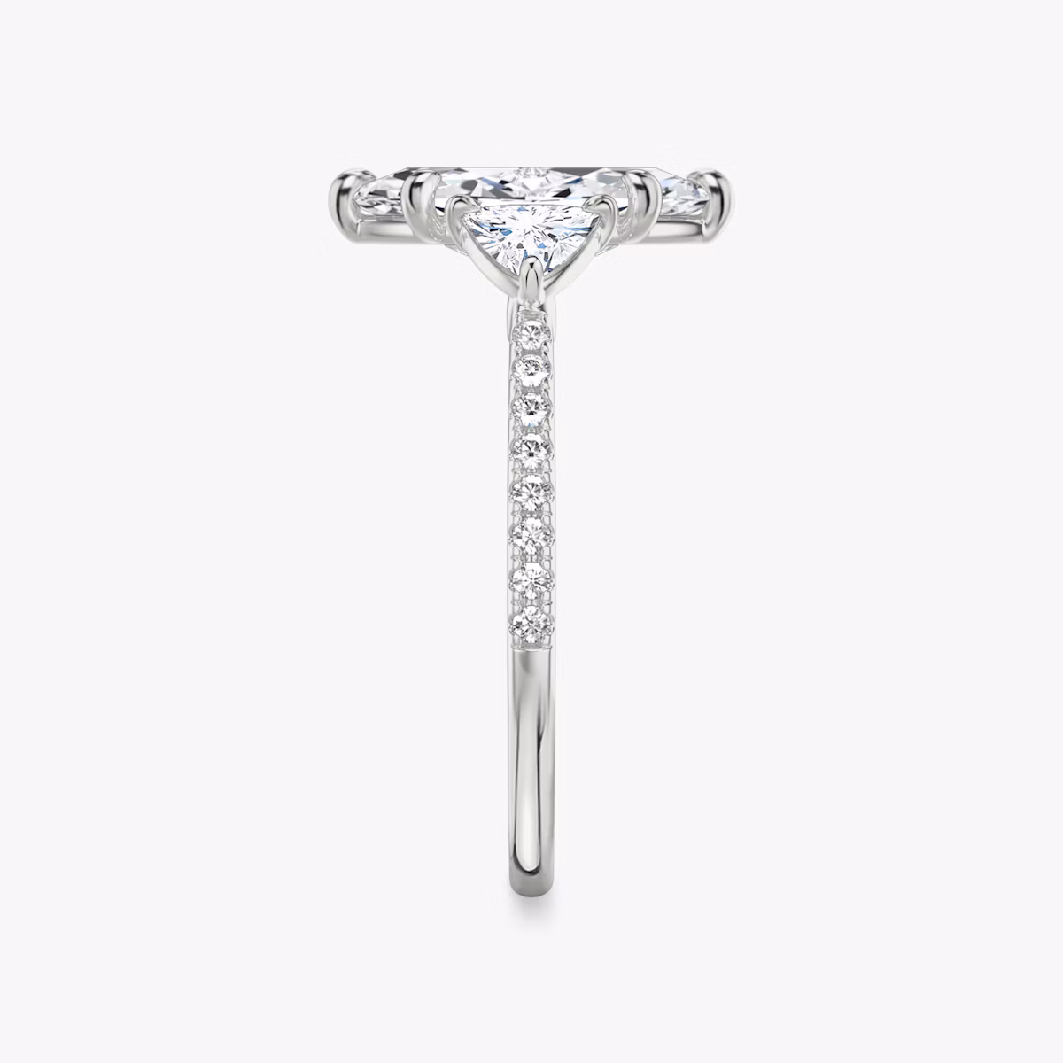 The Three Stone | Marquise | Platinum | bandAccent: Pavé | sideStoneCarat: 0.25ct | sideStoneShape: Trillion | diamondOrientation: vertical | caratWeight: other