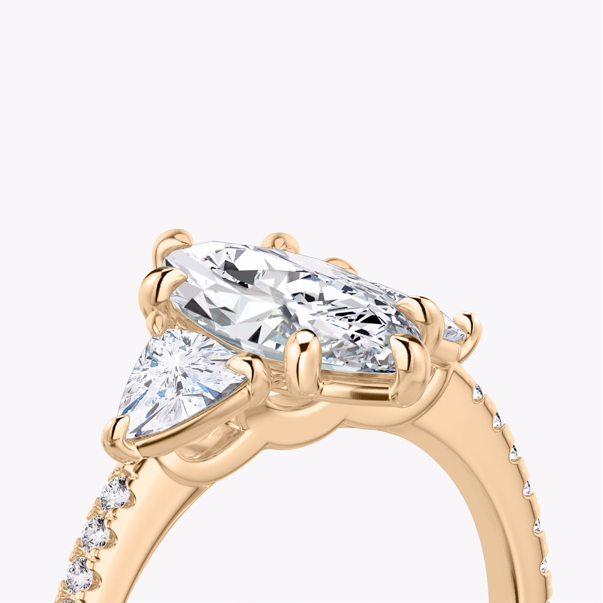 The Three Stone | Marquise | 14k | Rose Gold | bandAccent: Pavé | sideStoneCarat: 0.25ct | sideStoneShape: Trillion | diamondOrientation: vertical | caratWeight: other