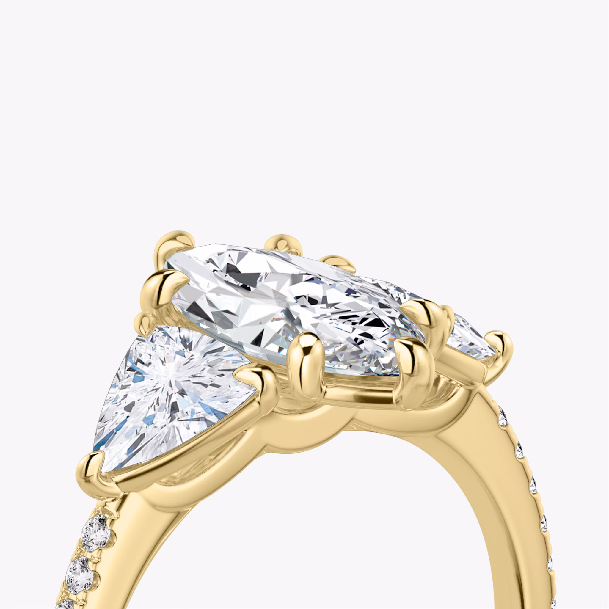 The Three Stone | Marquise | 18k | Yellow Gold | bandAccent: Pavé | sideStoneCarat: 0.50ct | sideStoneShape: Trillion | diamondOrientation: vertical | caratWeight: other