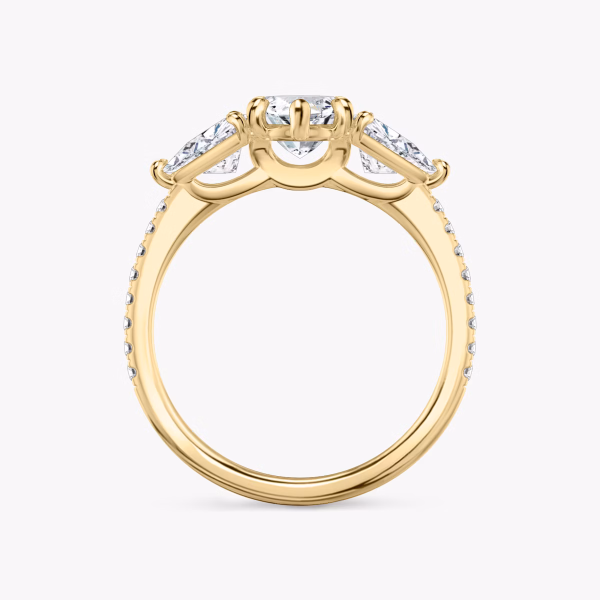The Three Stone | Marquise | 18k | Yellow Gold | bandAccent: Pavé | sideStoneCarat: 0.50ct | sideStoneShape: Trillion | diamondOrientation: vertical | caratWeight: other