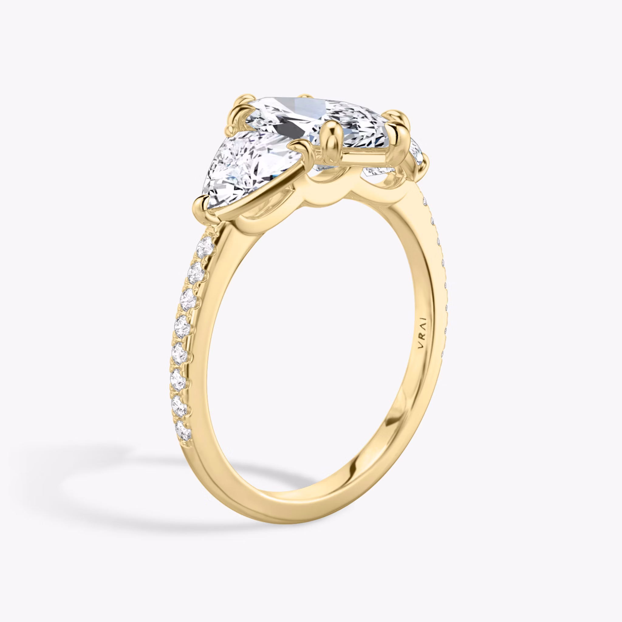 The Three Stone | Marquise | 18k | Yellow Gold | bandAccent: Pavé | sideStoneCarat: 0.50ct | sideStoneShape: Trillion | diamondOrientation: vertical | caratWeight: other