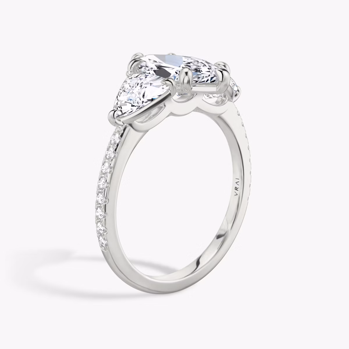 The Three Stone | Marquise | Platinum | bandAccent: Pavé | sideStoneCarat: 0.50ct | sideStoneShape: Trillion | diamondOrientation: vertical | caratWeight: other