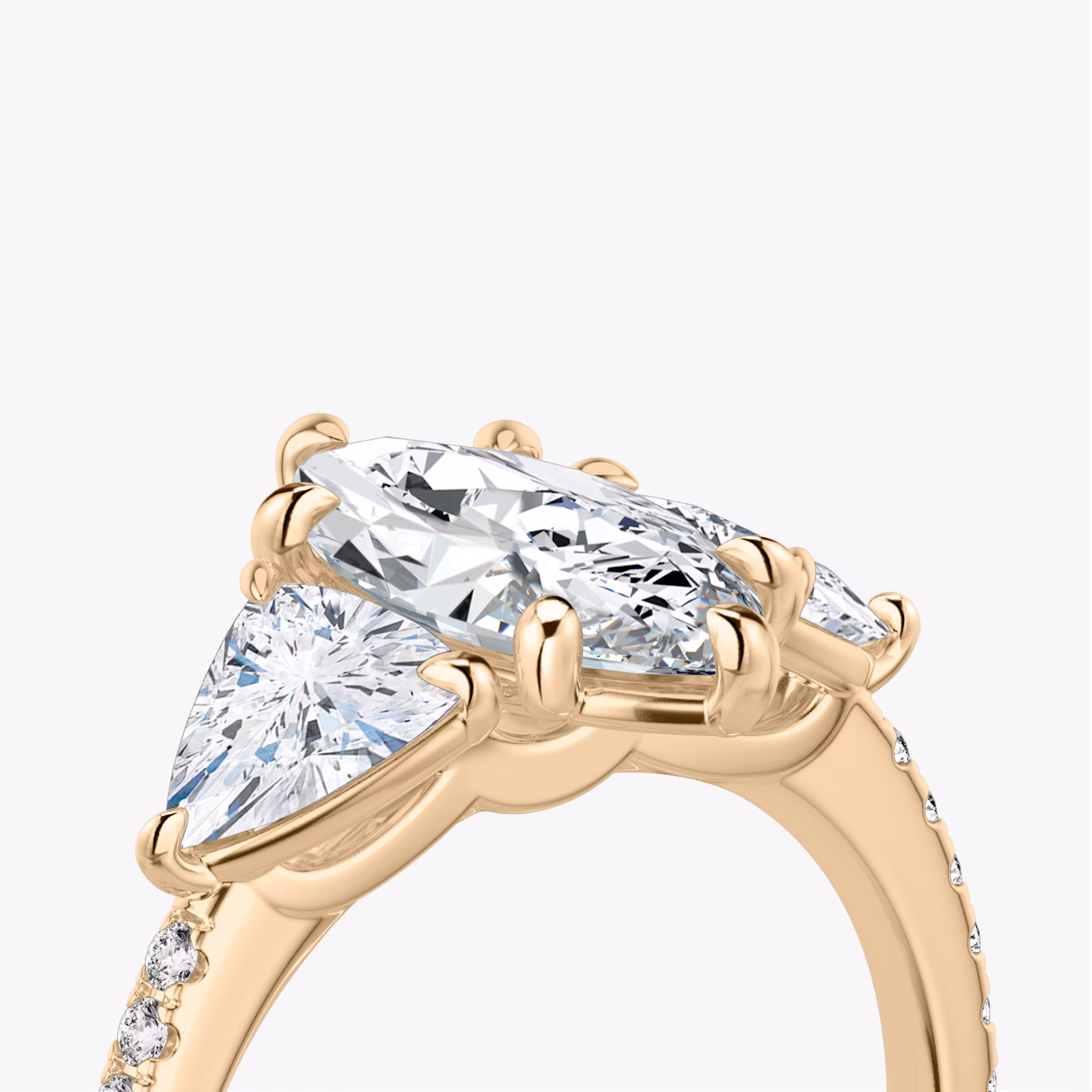 The Three Stone | Marquise | 14k | Rose Gold | bandAccent: Pavé | sideStoneCarat: 0.50ct | sideStoneShape: Trillion | diamondOrientation: vertical | caratWeight: other