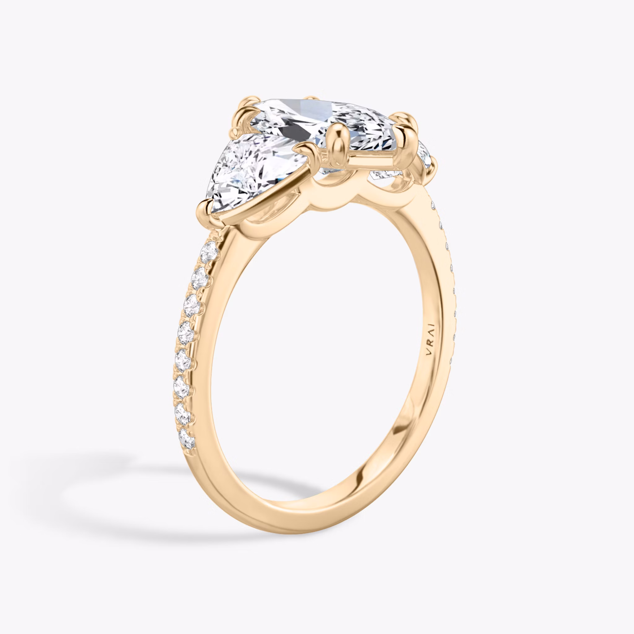 The Three Stone | Marquise | 14k | Rose Gold | bandAccent: Pavé | sideStoneCarat: 0.50ct | sideStoneShape: Trillion | diamondOrientation: vertical | caratWeight: other