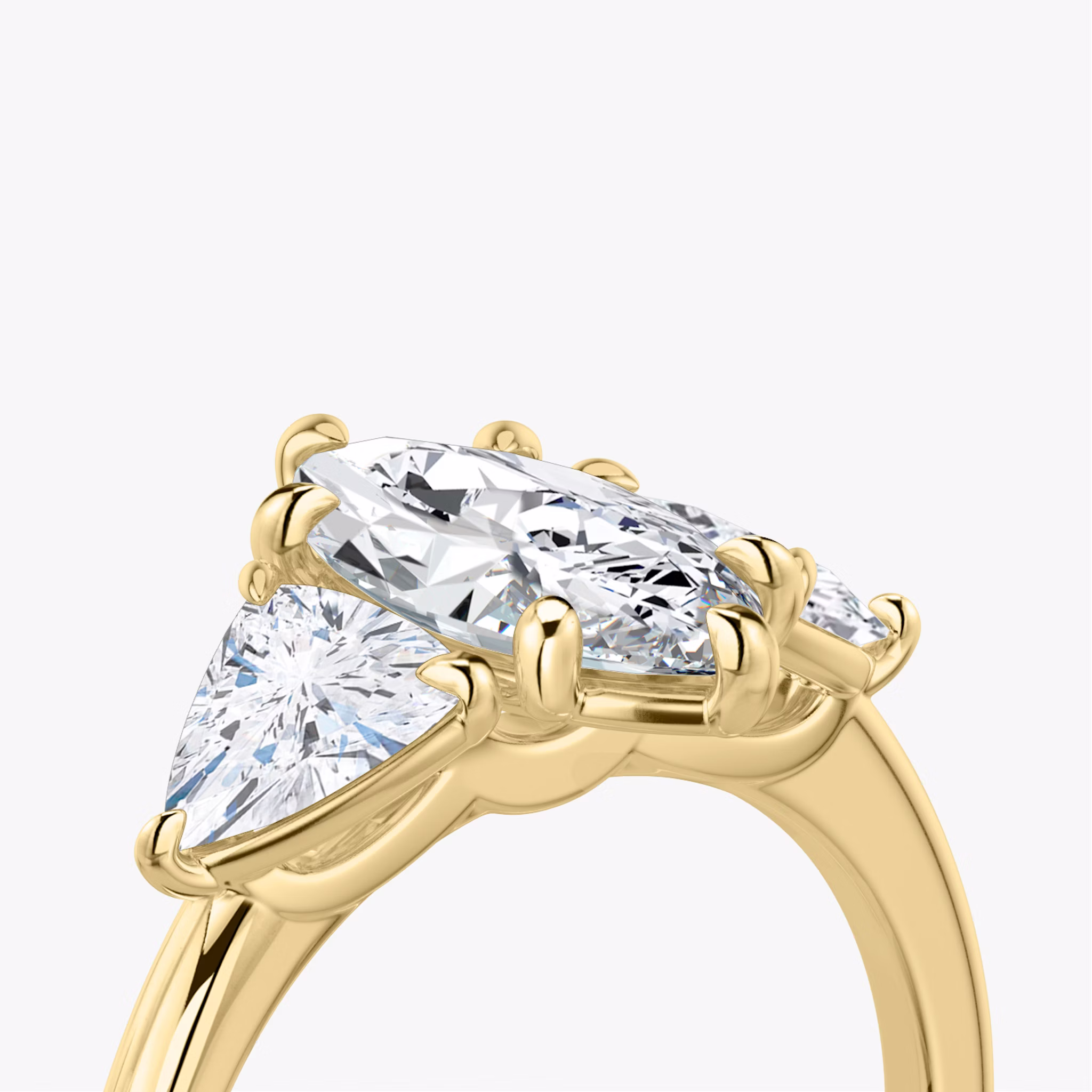 The Three Stone | Marquise | 18k | Yellow Gold | bandAccent: Plain | sideStoneCarat: 0.50ct | sideStoneShape: Trillion | diamondOrientation: vertical | caratWeight: other