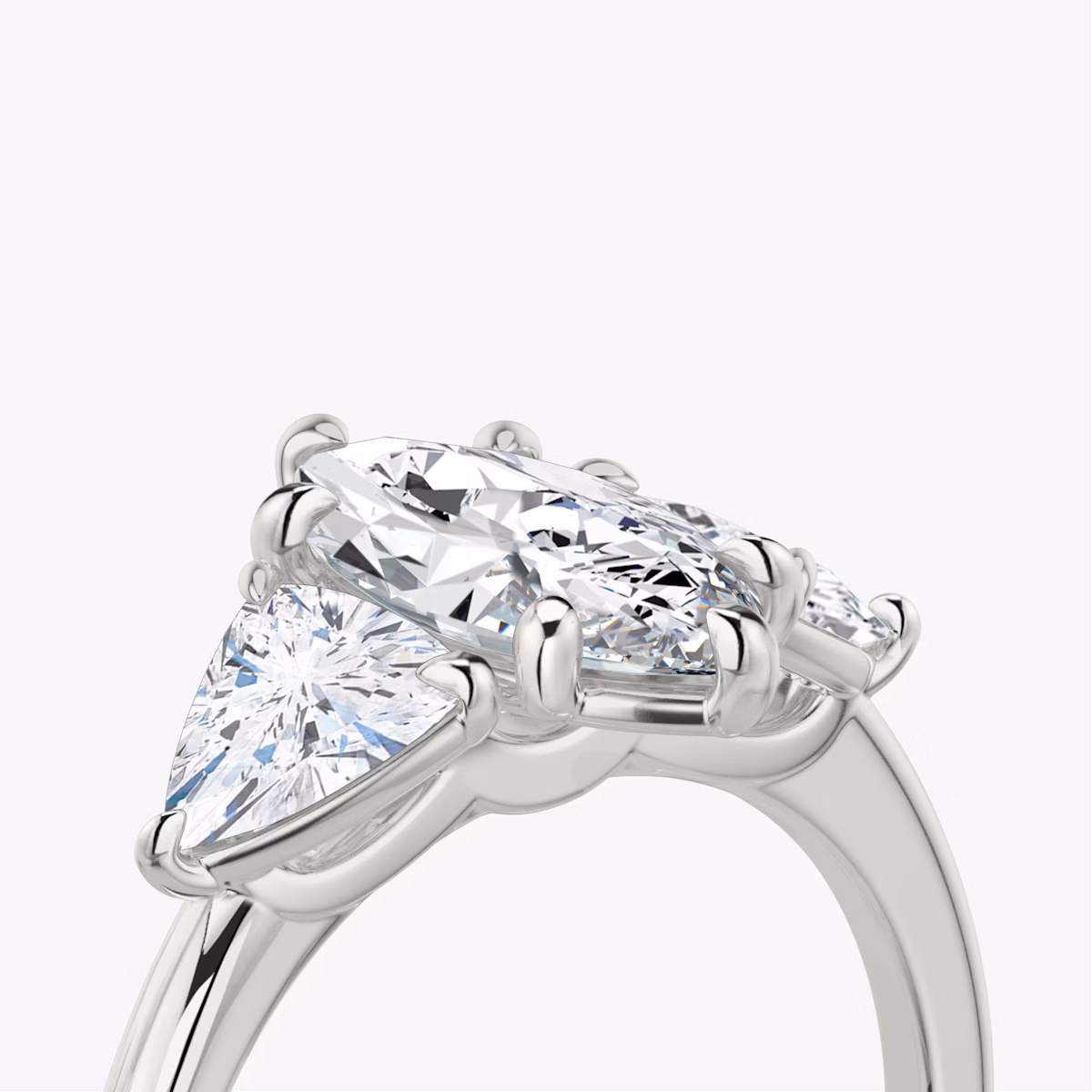 The Three Stone | Marquise | Platinum | bandAccent: Plain | sideStoneCarat: 0.50ct | sideStoneShape: Trillion | diamondOrientation: vertical | caratWeight: other