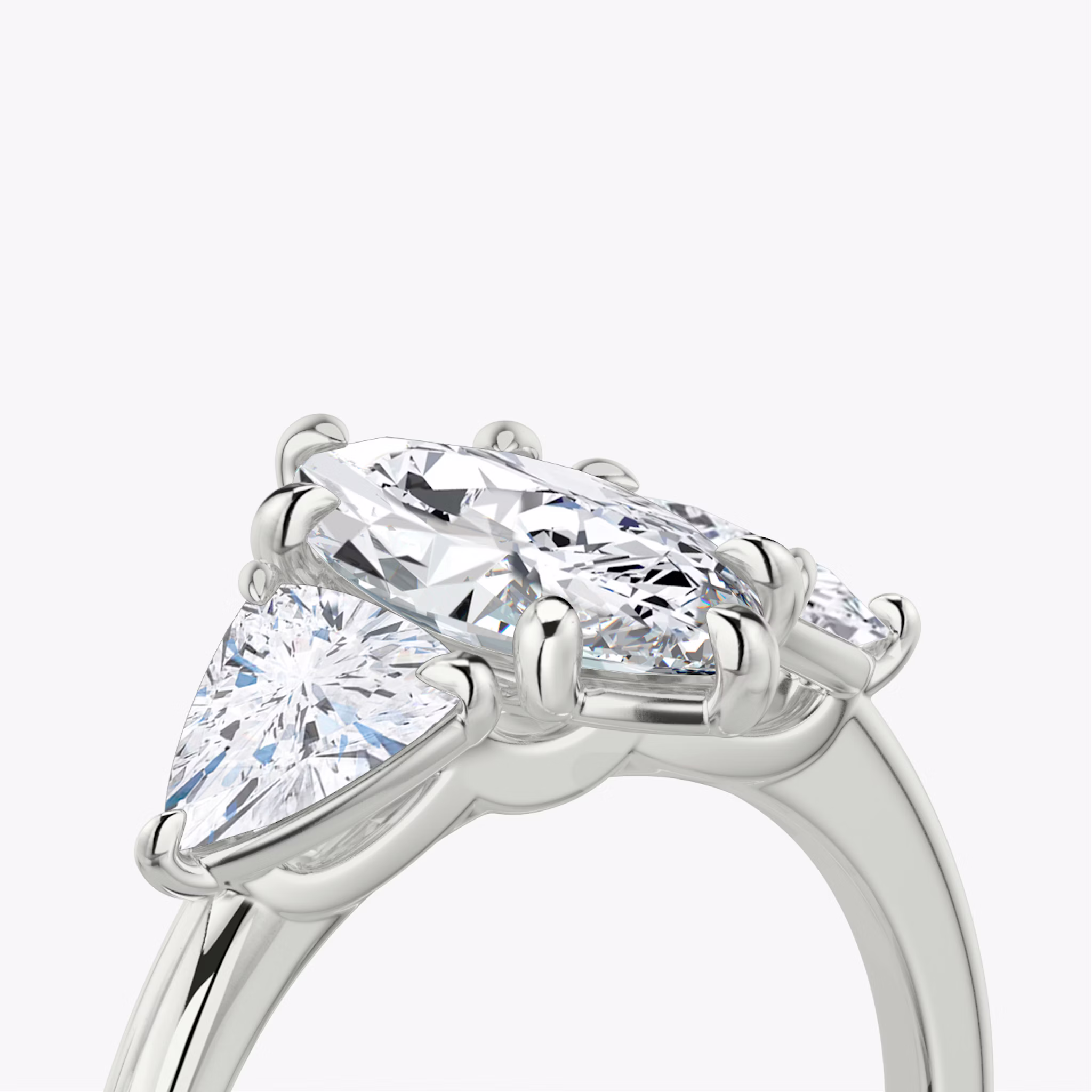 The Three Stone | Marquise | 18k | White Gold | bandAccent: Plain | sideStoneCarat: 0.50ct | sideStoneShape: Trillion | diamondOrientation: vertical | caratWeight: other