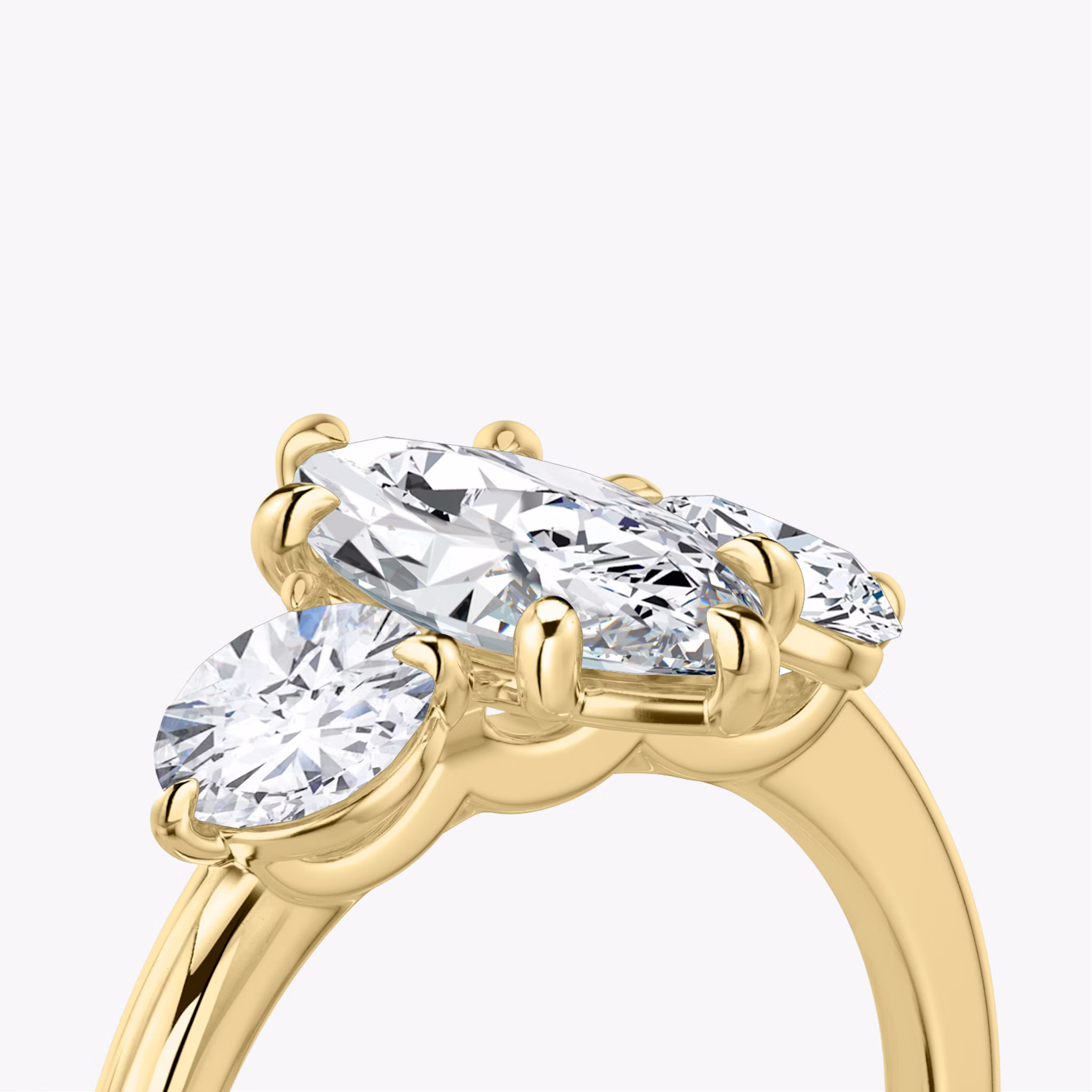 The Three Stone | Marquise | 18k | Yellow Gold | bandAccent: Plain | sideStoneCarat: 0.50ct | sideStoneShape: Round Brilliant | diamondOrientation: vertical | caratWeight: other