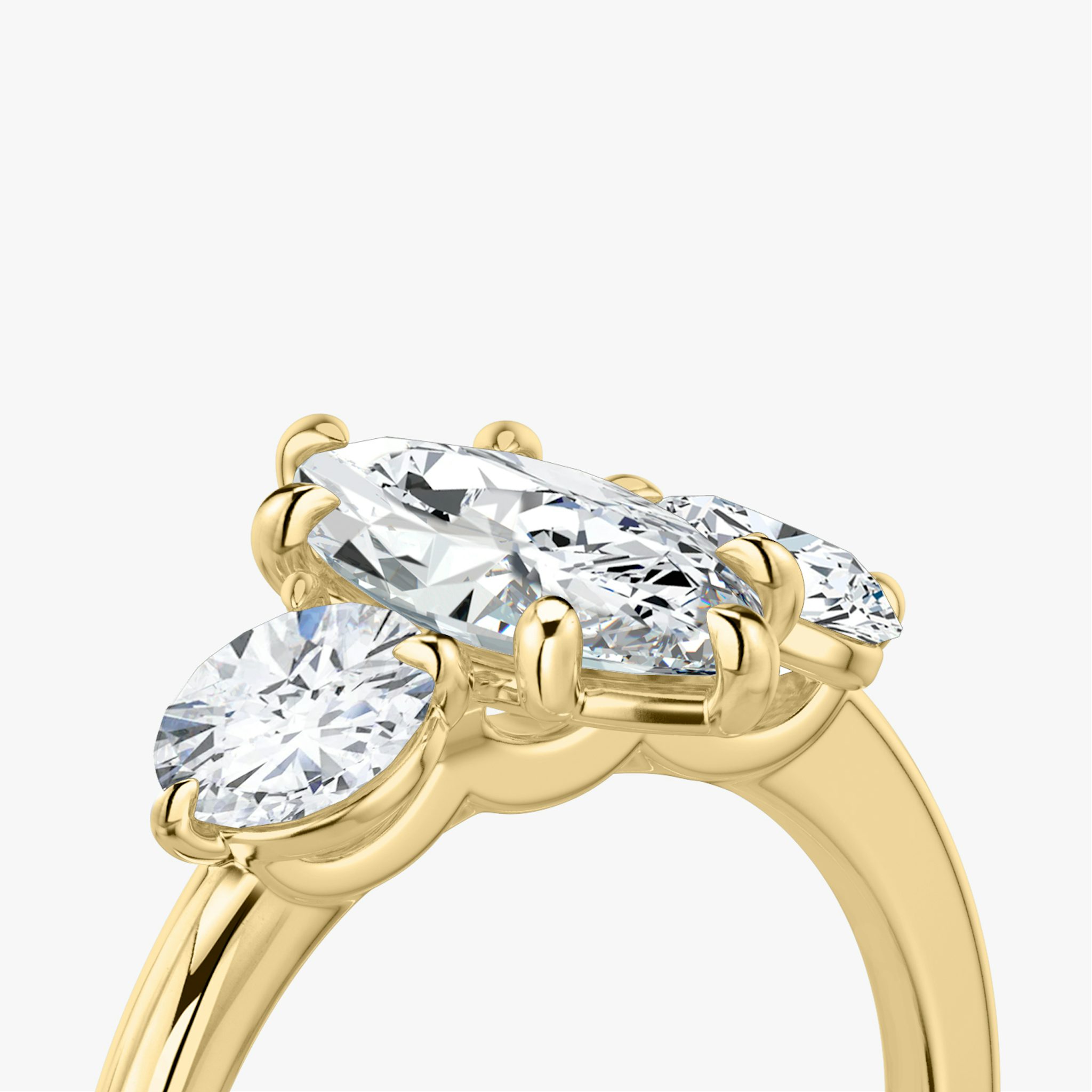 The Three Stone | Marquise | 18k | Yellow Gold | bandAccent: Plain | sideStoneCarat: 0.50ct | sideStoneShape: Round Brilliant | diamondOrientation: vertical | caratWeight: other