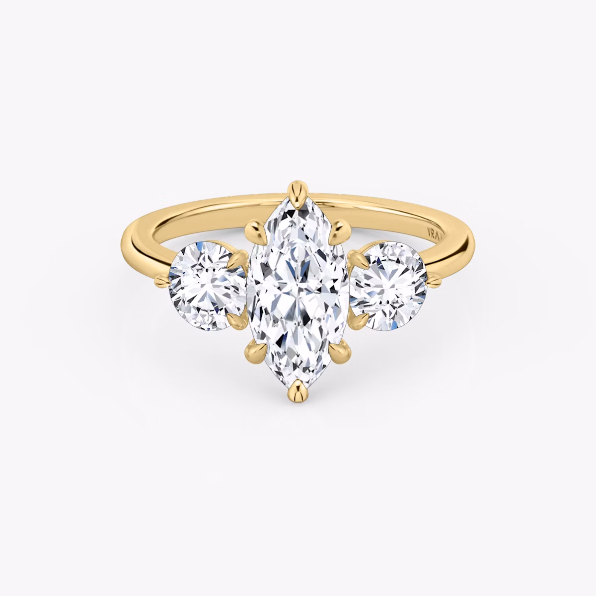 The Three Stone | Marquise | 18k | Yellow Gold | bandAccent: Plain | sideStoneCarat: 0.50ct | sideStoneShape: Round Brilliant | diamondOrientation: vertical | caratWeight: other