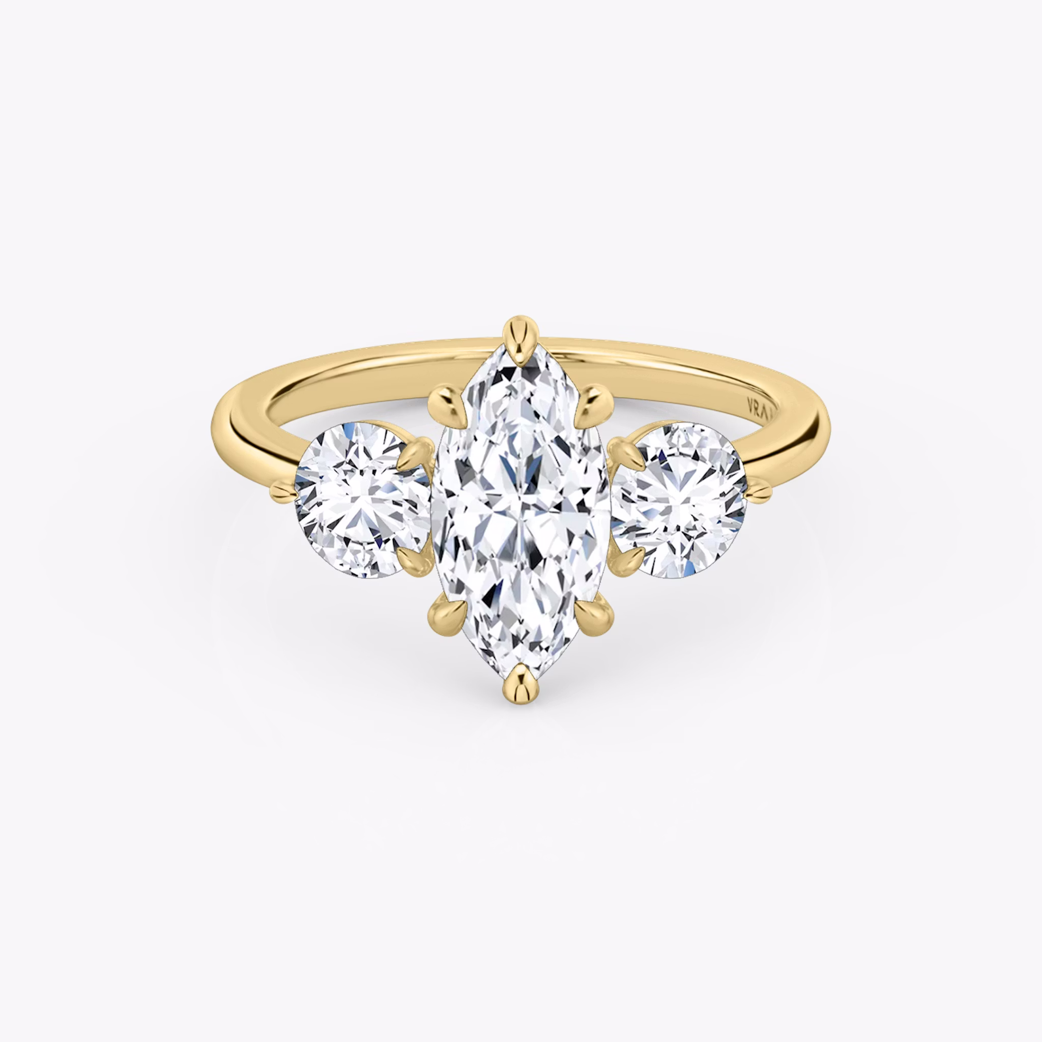 The Three Stone | Marquise | 18k | Yellow Gold | bandAccent: Plain | sideStoneCarat: 0.50ct | sideStoneShape: Round Brilliant | diamondOrientation: vertical | caratWeight: other