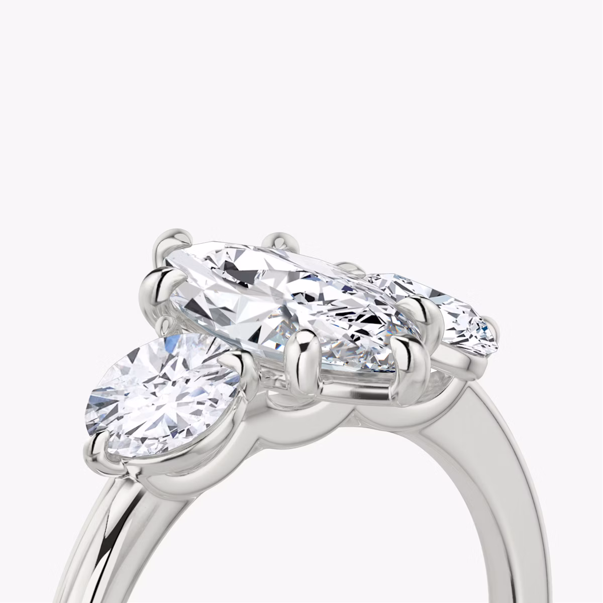The Three Stone | Marquise | Platinum | bandAccent: Plain | sideStoneCarat: 0.50ct | sideStoneShape: Round Brilliant | diamondOrientation: vertical | caratWeight: other