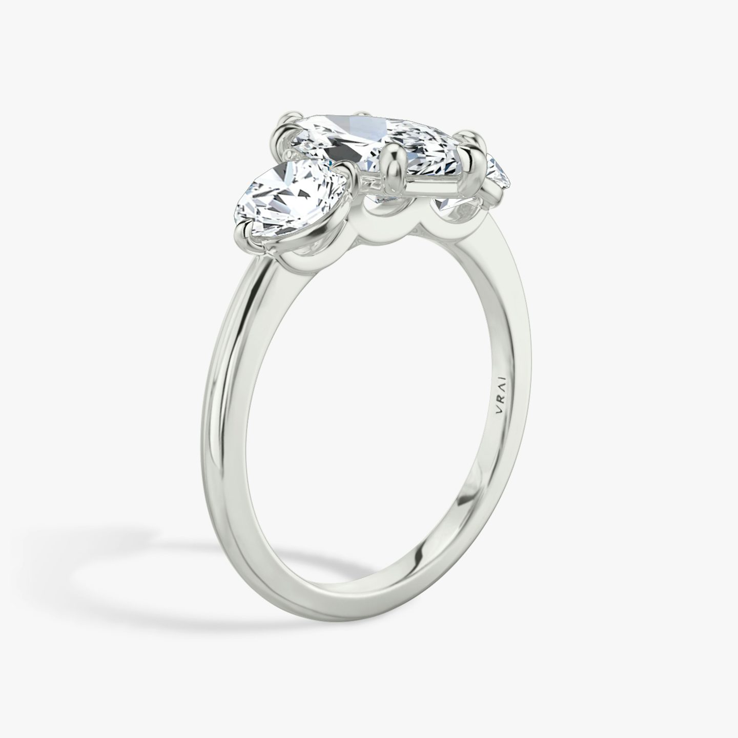 The Three Stone | Marquise | 18k | White Gold | bandAccent: Plain | sideStoneCarat: 0.50ct | sideStoneShape: Round Brilliant | diamondOrientation: vertical | caratWeight: other