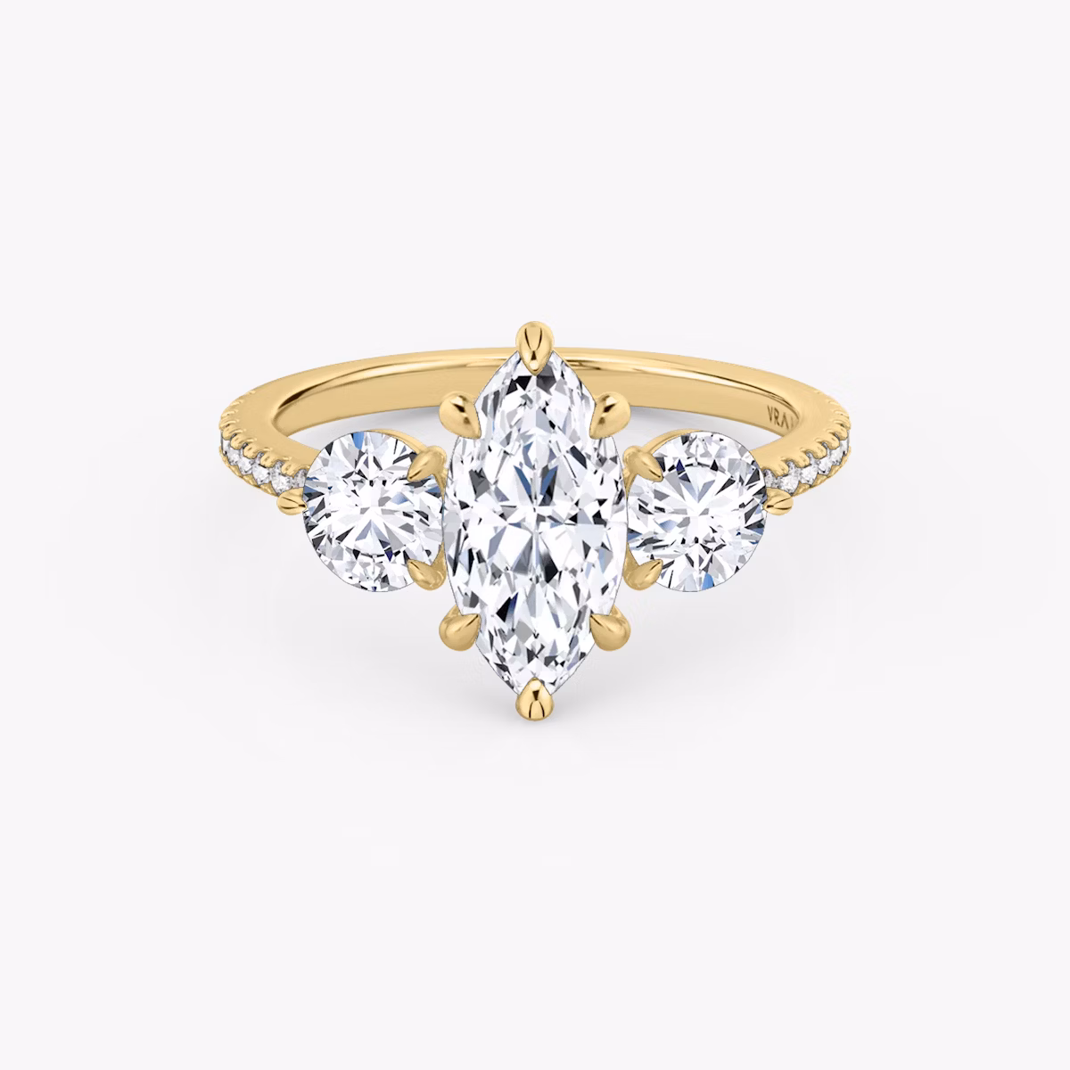 The Three Stone | Marquise | 18k | Yellow Gold | bandAccent: Pavé | sideStoneCarat: 0.50ct | sideStoneShape: Round Brilliant | diamondOrientation: vertical | caratWeight: other