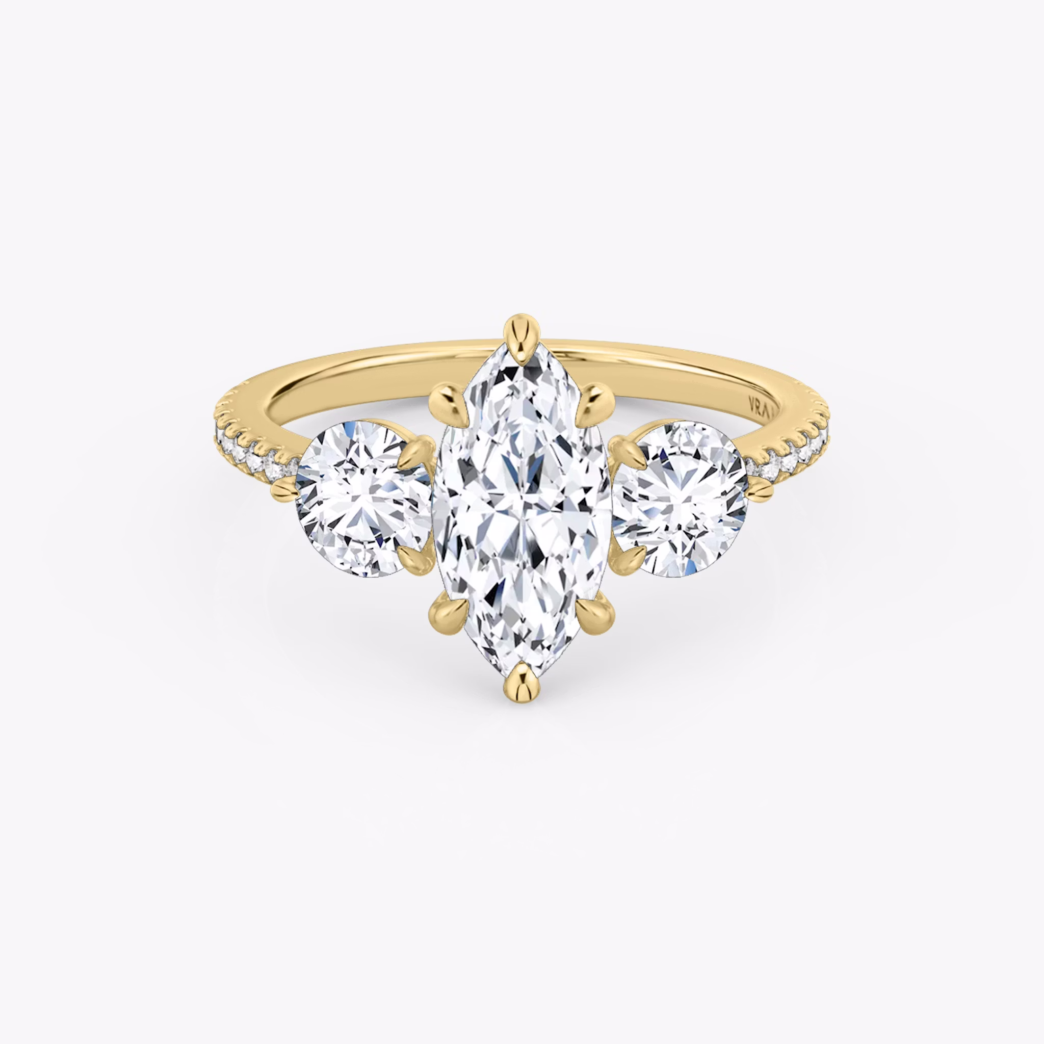 The Three Stone | Marquise | 18k | Yellow Gold | bandAccent: Pavé | sideStoneCarat: 0.50ct | sideStoneShape: Round Brilliant | diamondOrientation: vertical | caratWeight: other