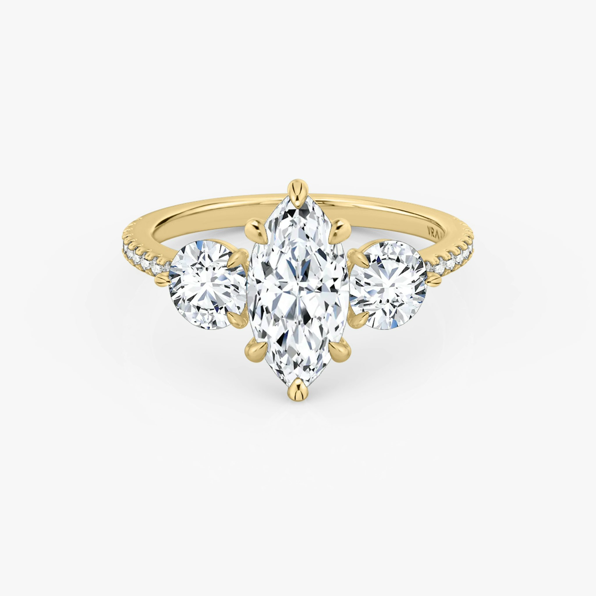 The Three Stone | Marquise | 18k | Yellow Gold | bandAccent: Pavé | sideStoneCarat: 0.50ct | sideStoneShape: Round Brilliant | diamondOrientation: vertical | caratWeight: other