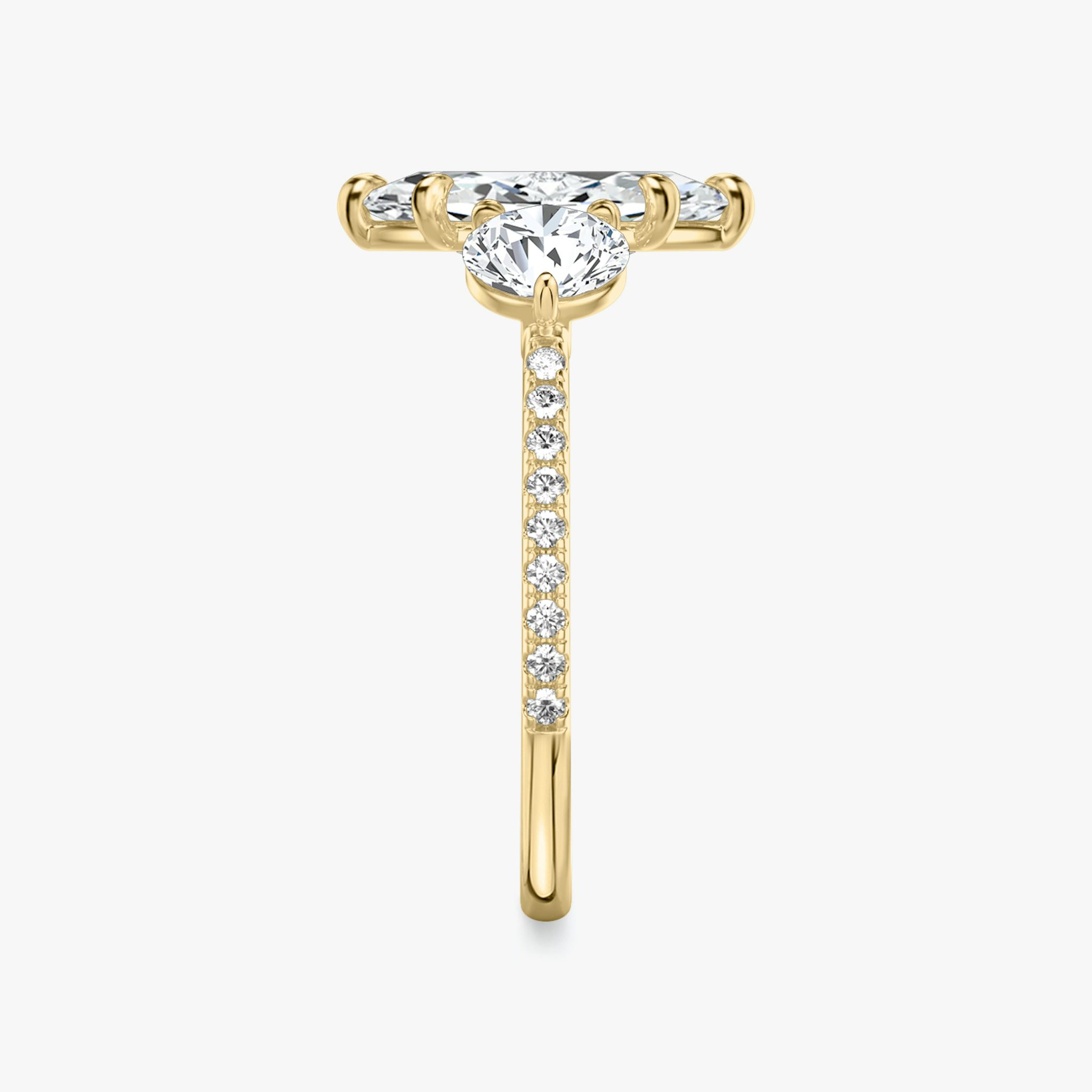 The Three Stone | Marquise | 18k | Yellow Gold | bandAccent: Pavé | sideStoneCarat: 0.50ct | sideStoneShape: Round Brilliant | diamondOrientation: vertical | caratWeight: other