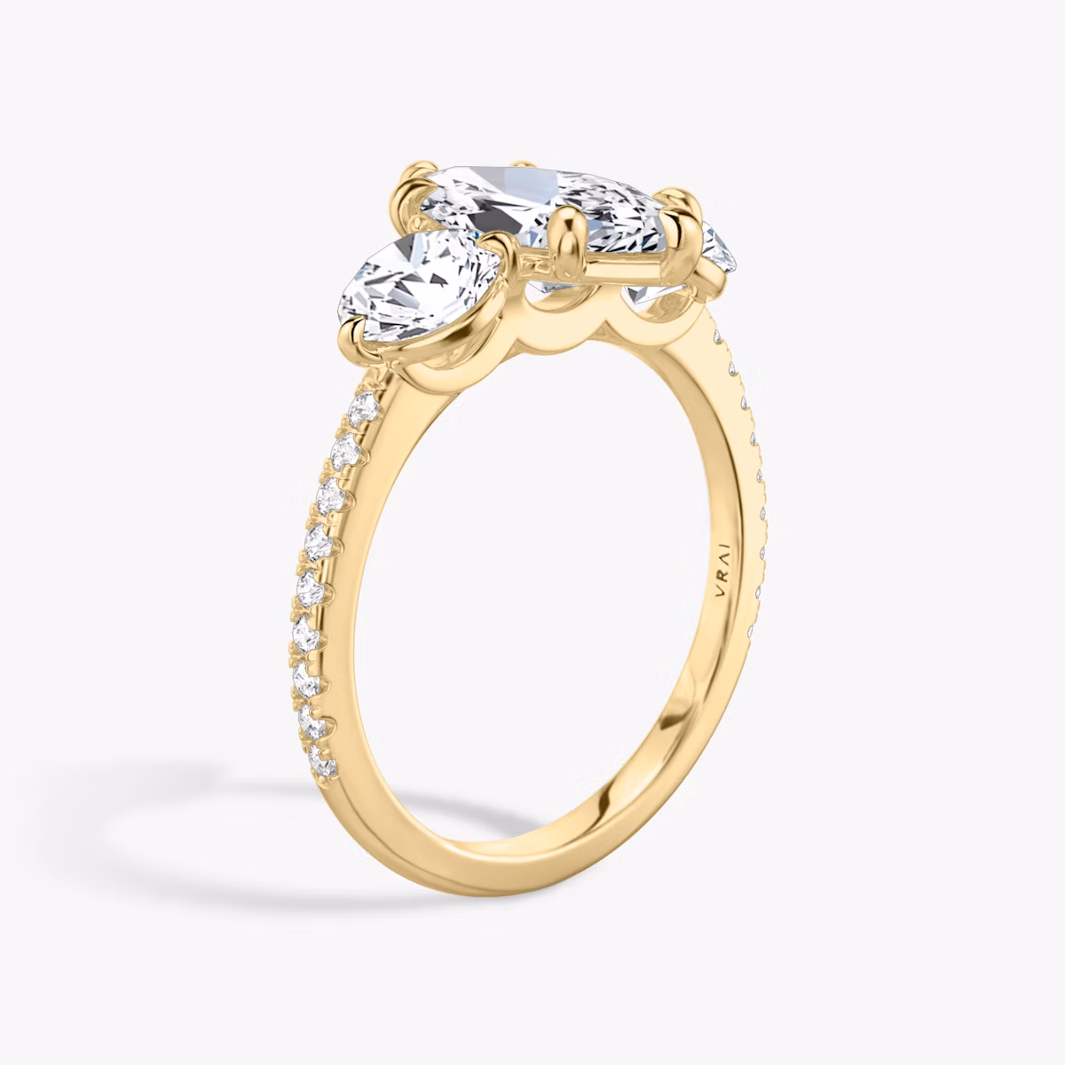 The Three Stone | Marquise | 18k | Yellow Gold | bandAccent: Pavé | sideStoneCarat: 0.50ct | sideStoneShape: Round Brilliant | diamondOrientation: vertical | caratWeight: other