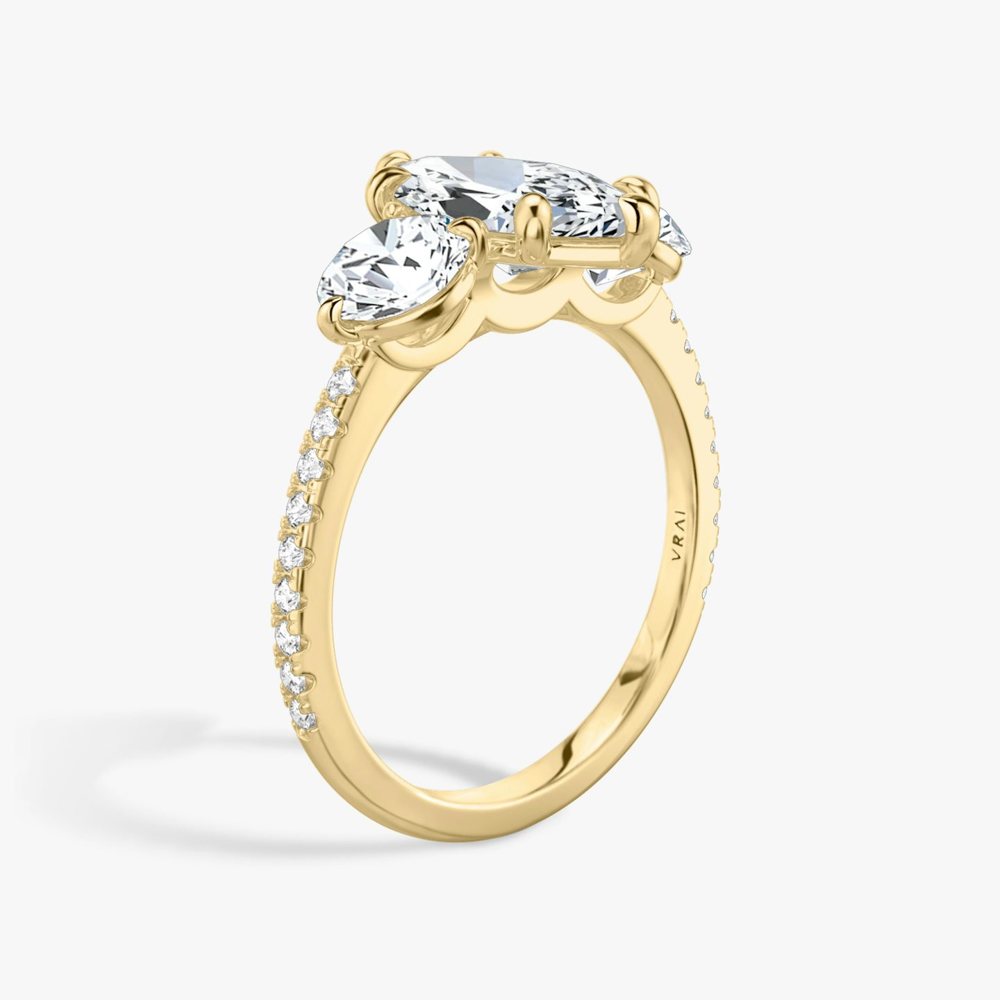 The Three Stone | Marquise | 18k | Yellow Gold | bandAccent: Pavé | sideStoneCarat: 0.50ct | sideStoneShape: Round Brilliant | diamondOrientation: vertical | caratWeight: other