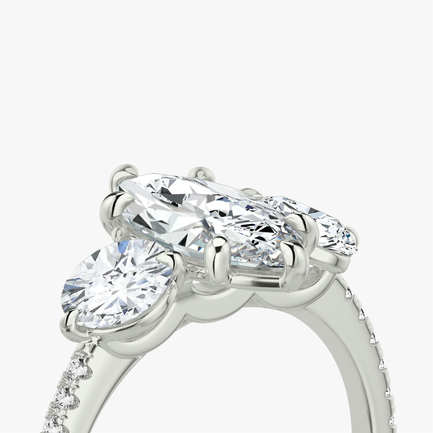 The Three Stone | Marquise | 18k | White Gold | bandAccent: Pavé | sideStoneCarat: 0.50ct | sideStoneShape: Round Brilliant | diamondOrientation: vertical | caratWeight: other