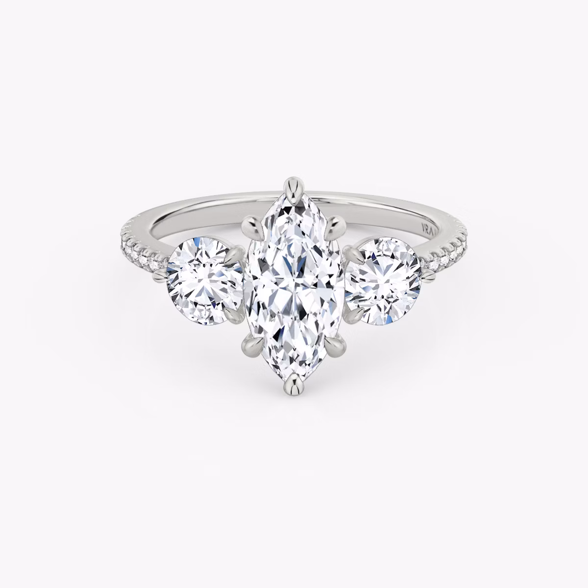 The Three Stone | Marquise | Platinum | bandAccent: Pavé | sideStoneCarat: 0.50ct | sideStoneShape: Round Brilliant | diamondOrientation: vertical | caratWeight: other