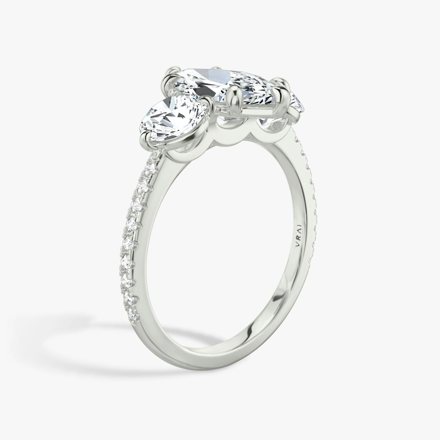 The Three Stone | Marquise | 18k | White Gold | bandAccent: Pavé | sideStoneCarat: 0.50ct | sideStoneShape: Round Brilliant | diamondOrientation: vertical | caratWeight: other