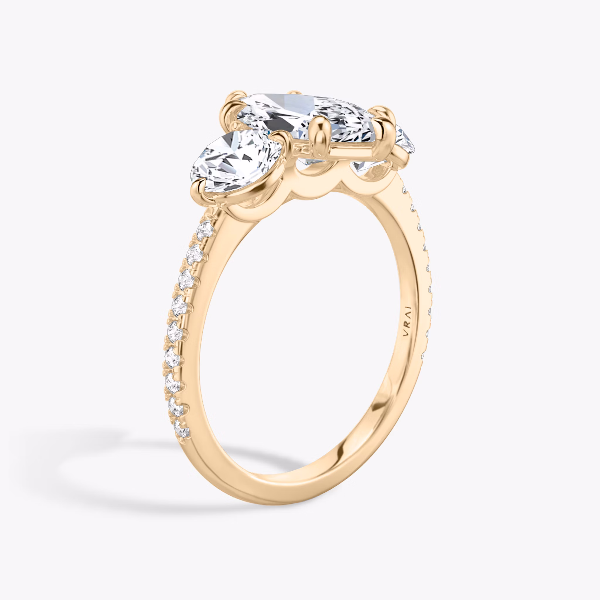 The Three Stone | Marquise | 14k | Rose Gold | bandAccent: Pavé | sideStoneCarat: 0.50ct | sideStoneShape: Round Brilliant | diamondOrientation: vertical | caratWeight: other